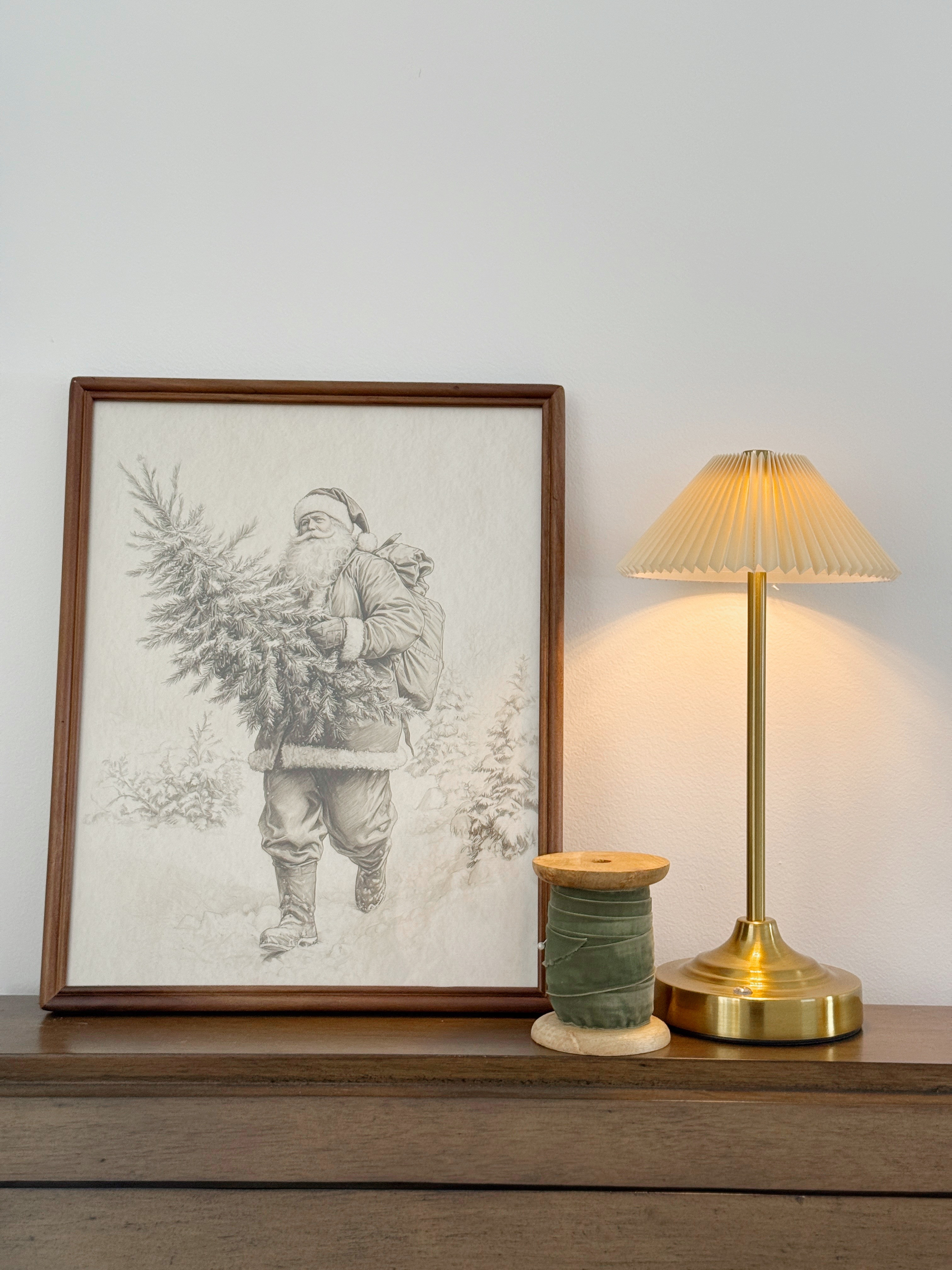 Table top Christmas decor #holiday #holidaydecor #lamp #framedChristmasart #ribbon #santa 

 #LTKHoliday #LTKSeasonal #LTKHome