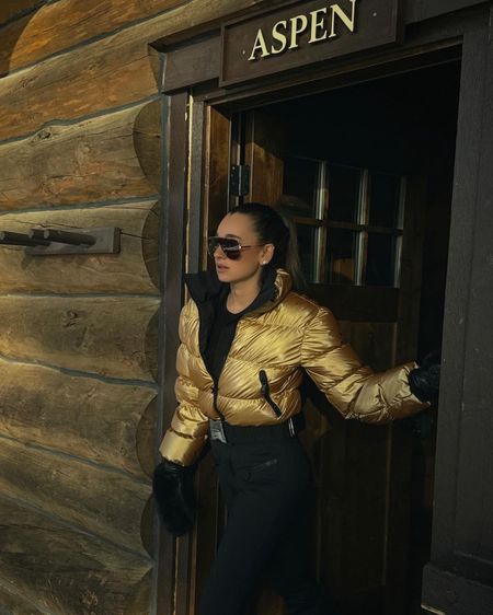 Obsessed with this gold ski suit and matching sunglasses