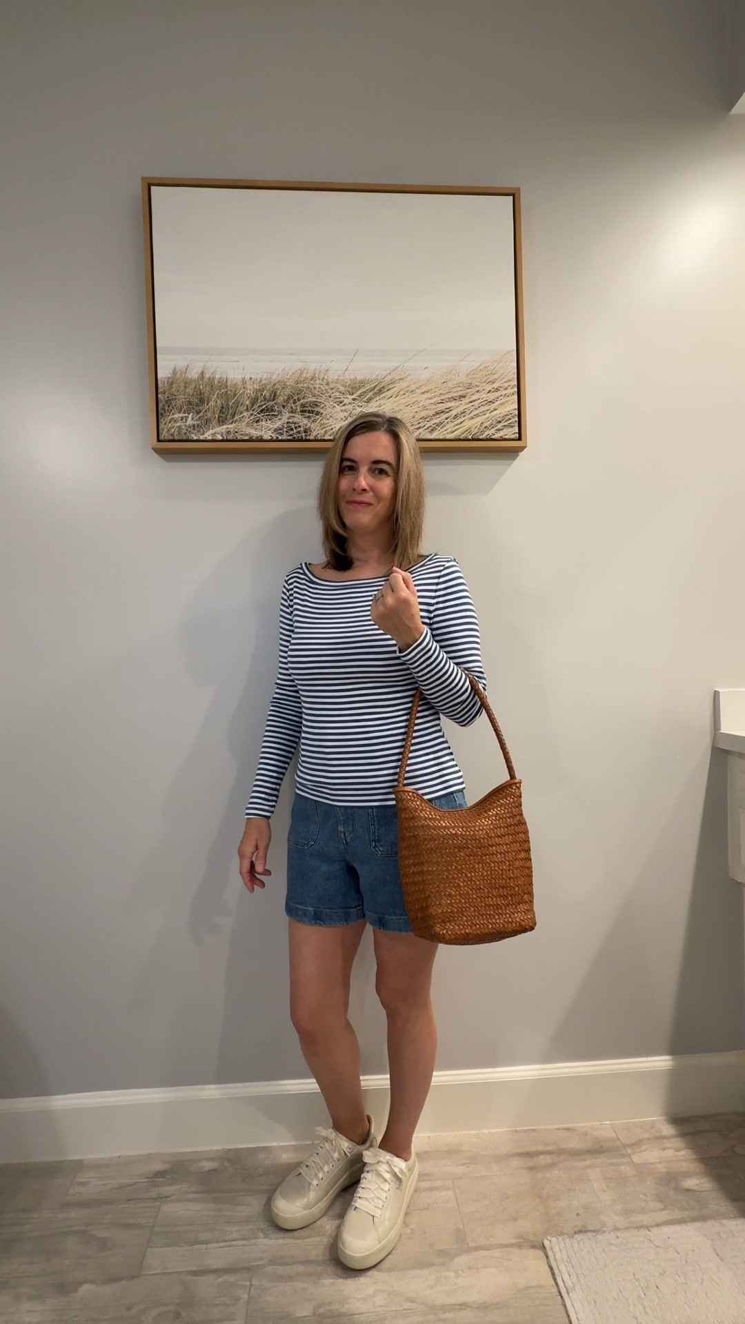 Loving this soft long tee - blue and white striped top with these denim shorts. 💙🤍The denim shorts come in curvy or regular fit. I am wearing the curvy denim shorts to give me a more relaxed look. Paired with comfortable sneakers and a woven purse. This blue striped top outfit reminds me of Americana and would be perfect for Americas 250th anniversary! -

#LTKootd #LTKOver40 #LTKPetite