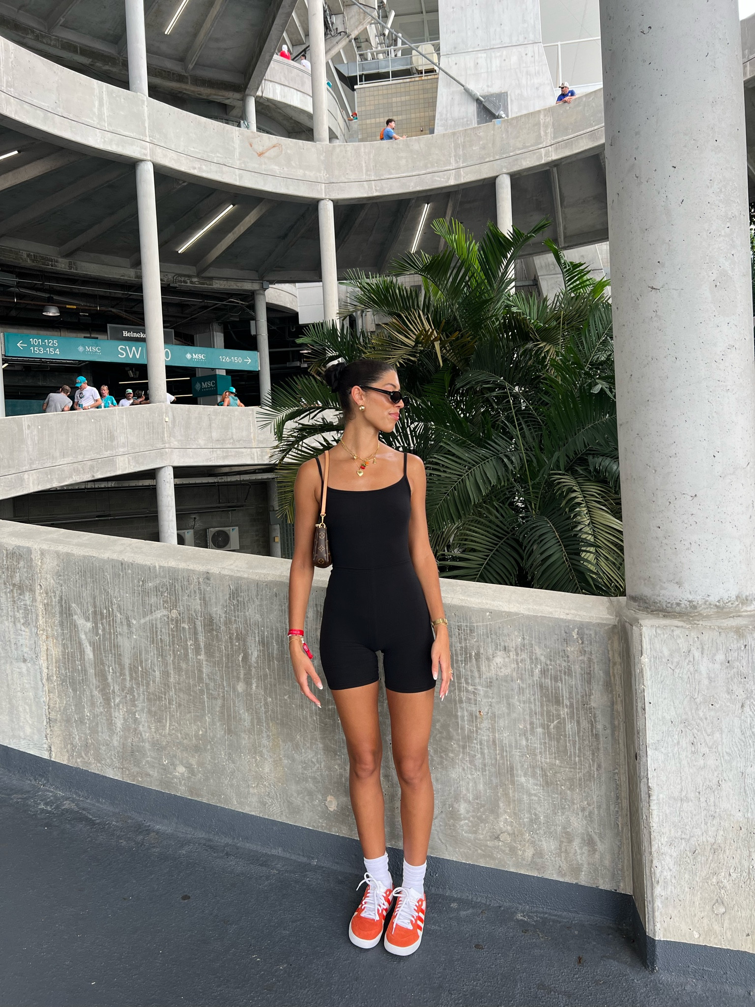 when the fins win >> 🐬🧡✨

black romper: aritzia
Louis Vuitton bag 
black round sunglasses: amazon
orange tyshawn adidas
gold jewelery 