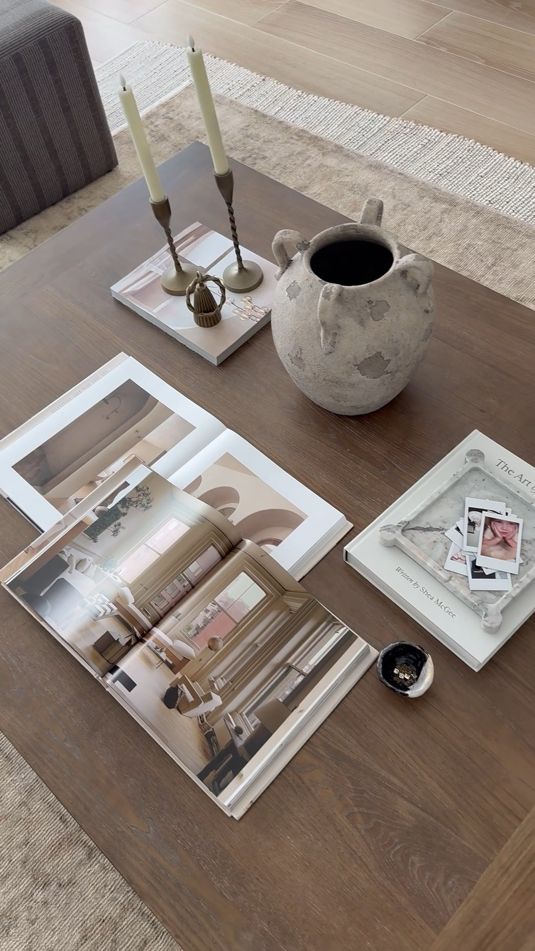 Your coffee table doesn’t need more decor — it needs the right pieces. 

Here are 5 styling must-haves:

1. Coffee table books — stack 2–3 books to create height, interest, and an easy foundation
2. A statement vase — oversized or sculptural vases instantly elevate the entire table
3. Candles — they add warmth, ambiance, and that cozy lived-in feeling
4. Something organic — wood, greenery or stone bring balance and texture
5. Something personal — a meaningful object, small framed photo, or collection of Polaroids makes the space feel like you

The key to a designer look? Mix height, texture, and personal touches so it feels layered and intentional.

🤎 Share and follow House.on.TeelHill for more home design and styling! 

🛍️ Shop everything in my home on LTK
•

Modern Organic | Home Decor | Neutral Decor | Interior Design | Interior Decor | Home Styling | Home Transformation 
•
•
•
#homedesign #homeinspiration #homestyling #livingroomdesign #livingroomstyling

#LTKSeasonal #LTKHome #LTKSaleAlert