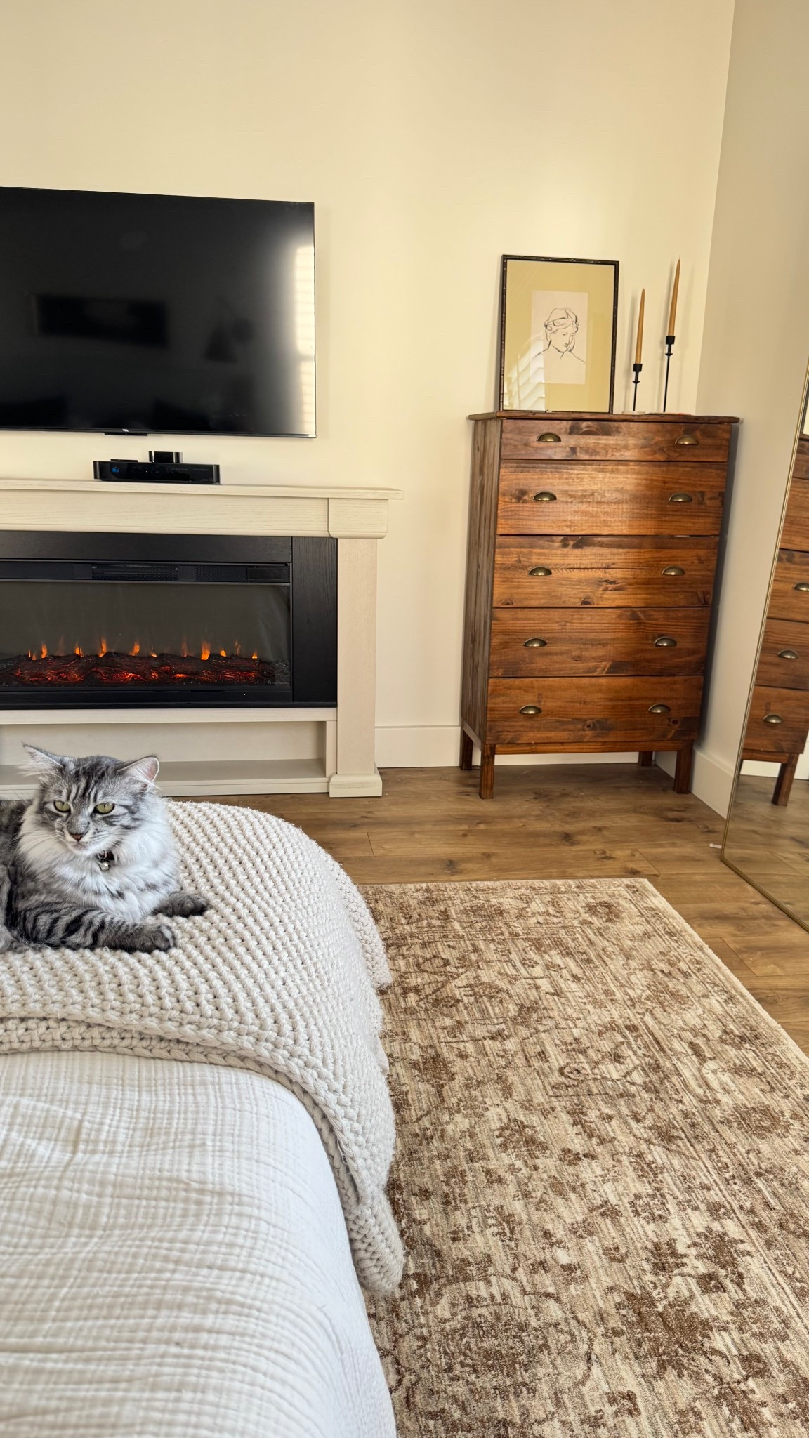 New gorgeous Loloi area rug in our bedroom along with the coziest electric fireplace 🔥  Rug is in the “natural/bark” color option and it’s perfect!!