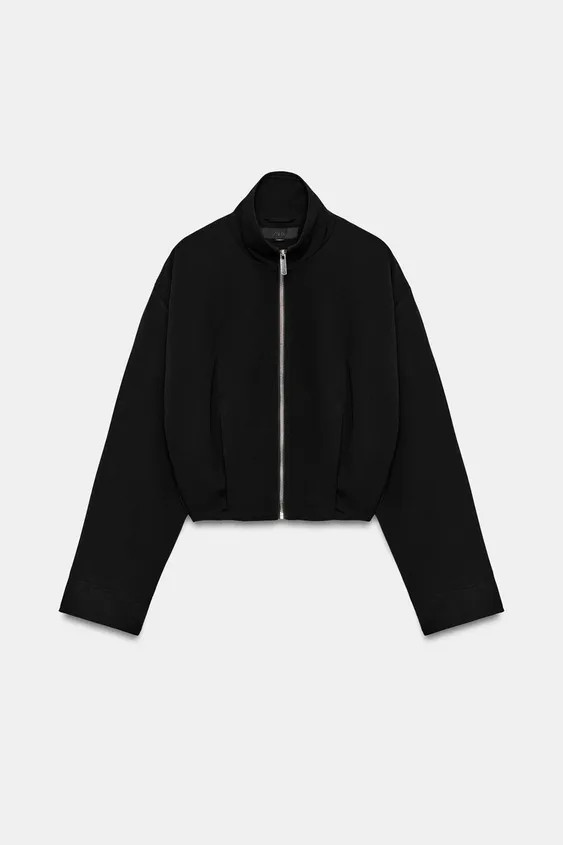 Bomber-style jacket with a high neck and long sleeves. Featuring side pockets concealed in the se... | Zara UK