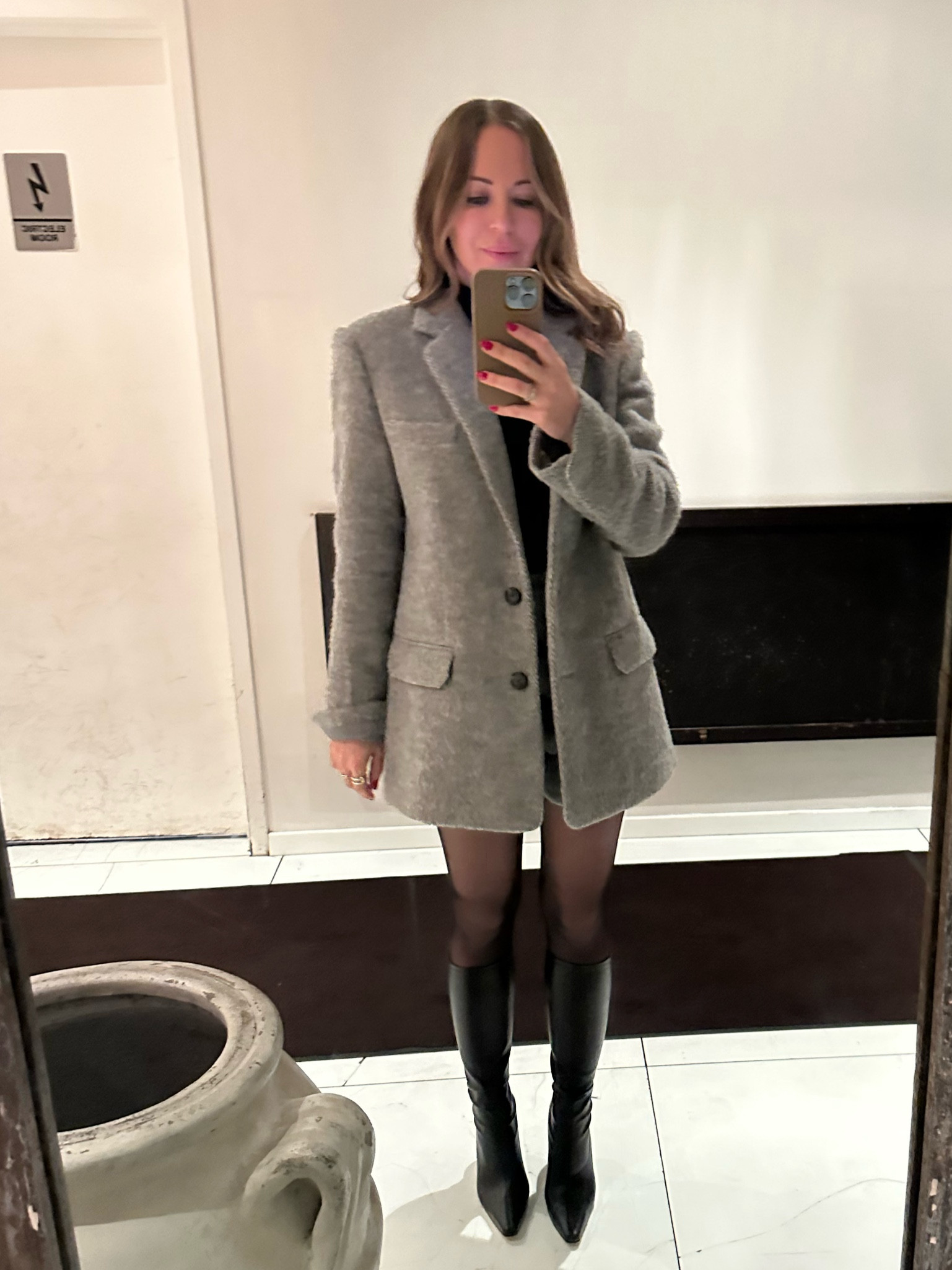 Wearing a size 4 in the blazer (runs oversized) and the skirt. Boots run TTS.