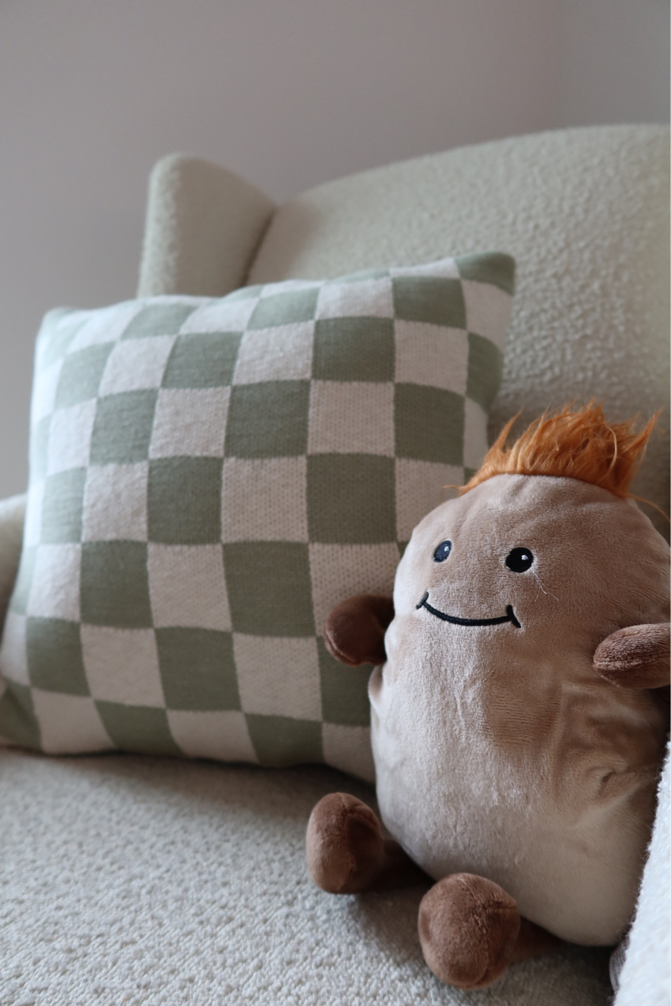 Nursery cozy corner. Boucle recliner, checkered pillow (from TJ Maxx so linked similar), warmers potato 🥔 

#LTKkids #LTKbaby #LTKhome