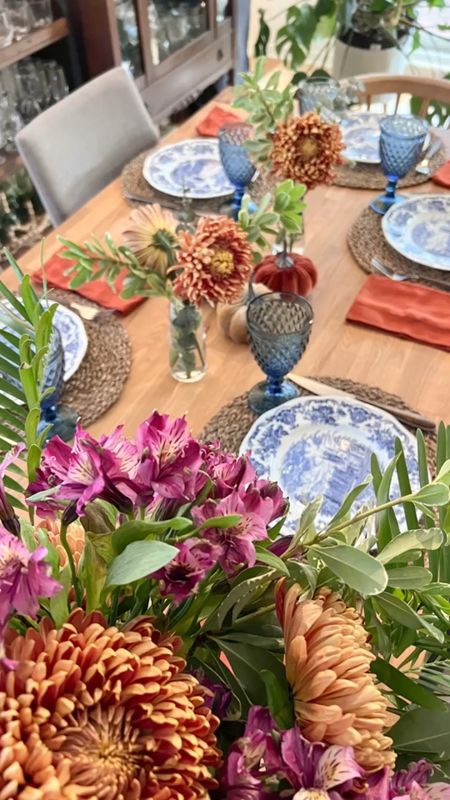 Blue and white vintage china mixed with velvet pumpkins, brick coloured napkin and natural fiver placemats. Top it off with jewel tones fresh flowers 

#LTKstyletip #LTKhome #LTKSeasonal