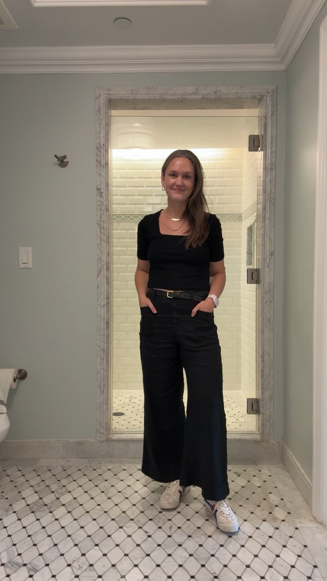 It’s a long Monday of travel from Chicago to Orlando, and the city mom is keeping it effortlessly cool in black linen cropped wide-leg pants and a black square-neck cropped top, her favorite sneakers cushioning every step, gold hoops glinting in airport lights, and her herringbone necklace layered with her graduated rope necklace, bracelets stacked high as ever. Between tag-teaming with three other adults to corral her toddler, who’s mostly charming and surprisingly cooperative, they somehow make it through Ubers, security, and flights, landing exhausted but buzzing with excitement, ready to swap skyscrapers for sunshine—even if she’s already dreaming of a quiet cocktail before bedtime.

#LTKTravel #LTKFamily #LTKStyleTip