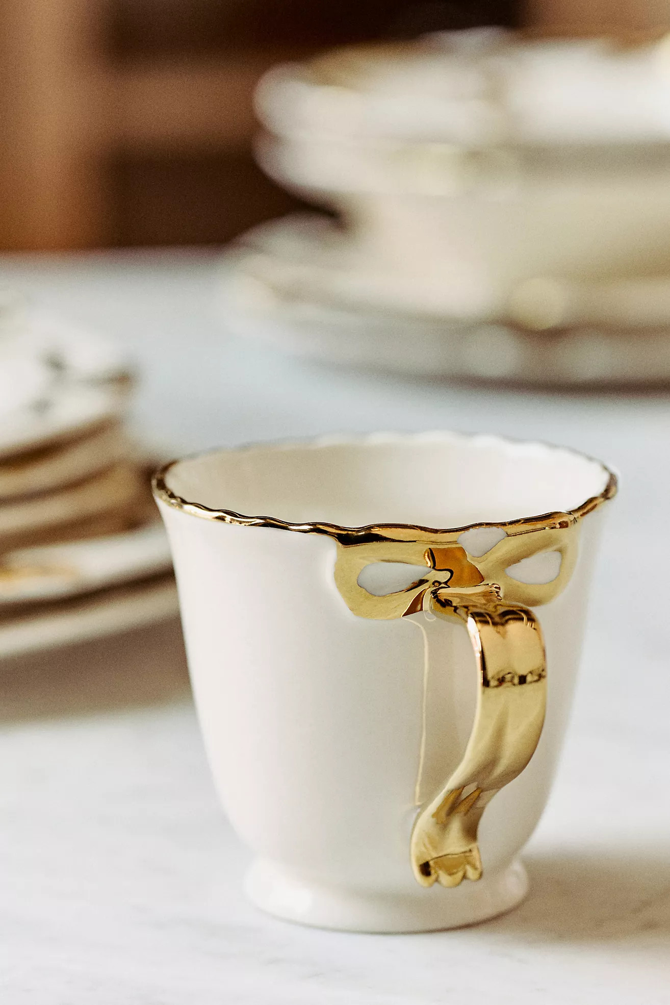 Benedita Bow Stoneware Gold Mug | Anthropologie (US)