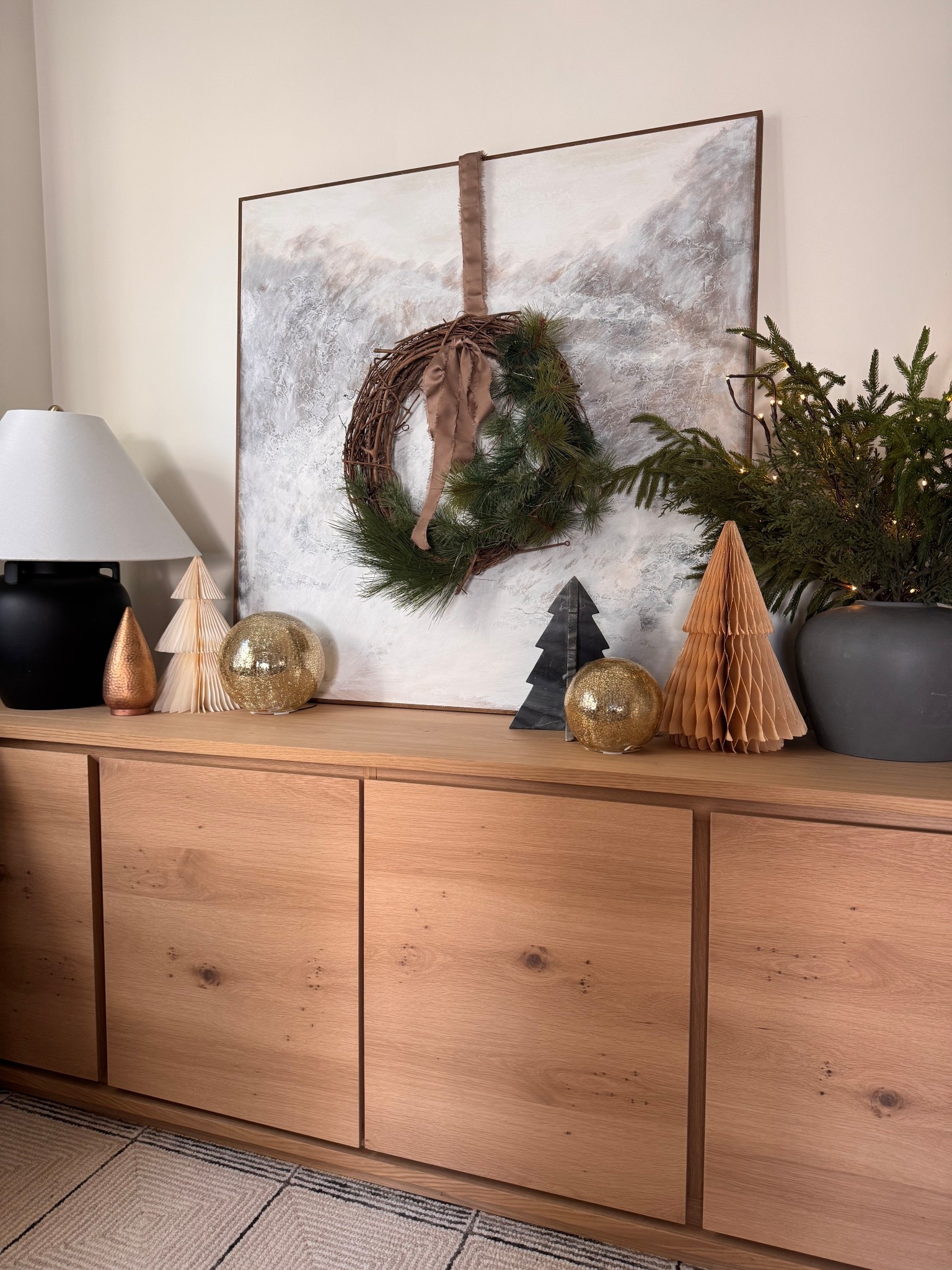 Layered neutrals, soft metallics, and simple winter greens for a calm, elevated holiday moment 🤍
Every piece here is easy to mix, store, and reuse year after year — linked for easy shopping.

#wreath
#winterwreath
#pinewreath
#neutralwreath
#sideboard
#sideboardstyling
#buffettable
#consoledecor
#holidayconsole
#holidayvignette
#neutralholidaydecor
#modernholidaydecor
#winterdecor
#christmasvignette
#homevignette
#tablelamp
#blacktablelamp

#LTKFindsUnder50 #LTKHome #LTKHoliday