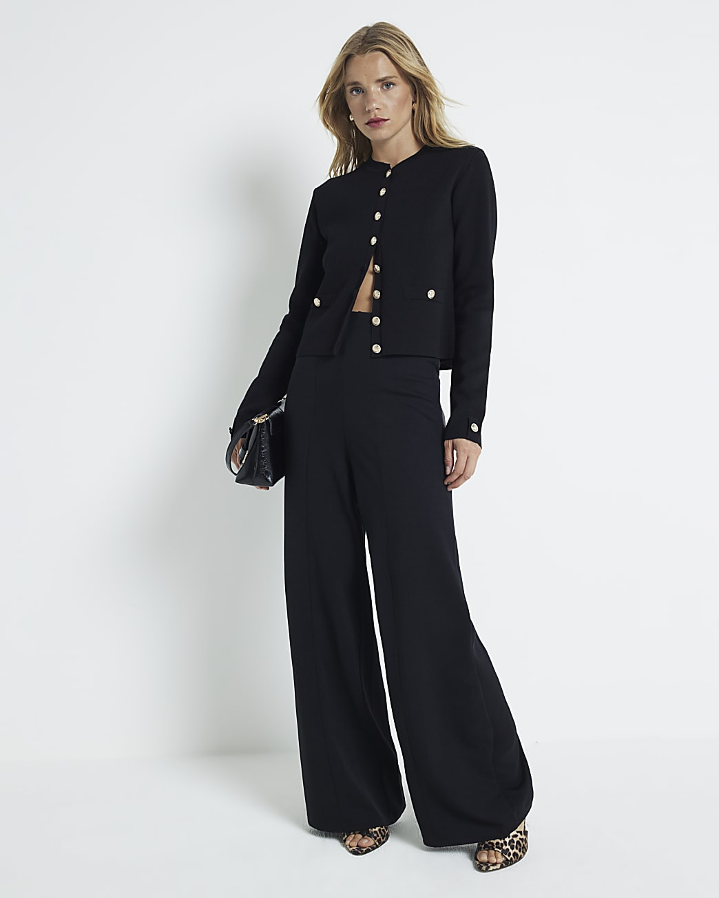 Black stitched wide leg trousers | River Island (UK & IE)