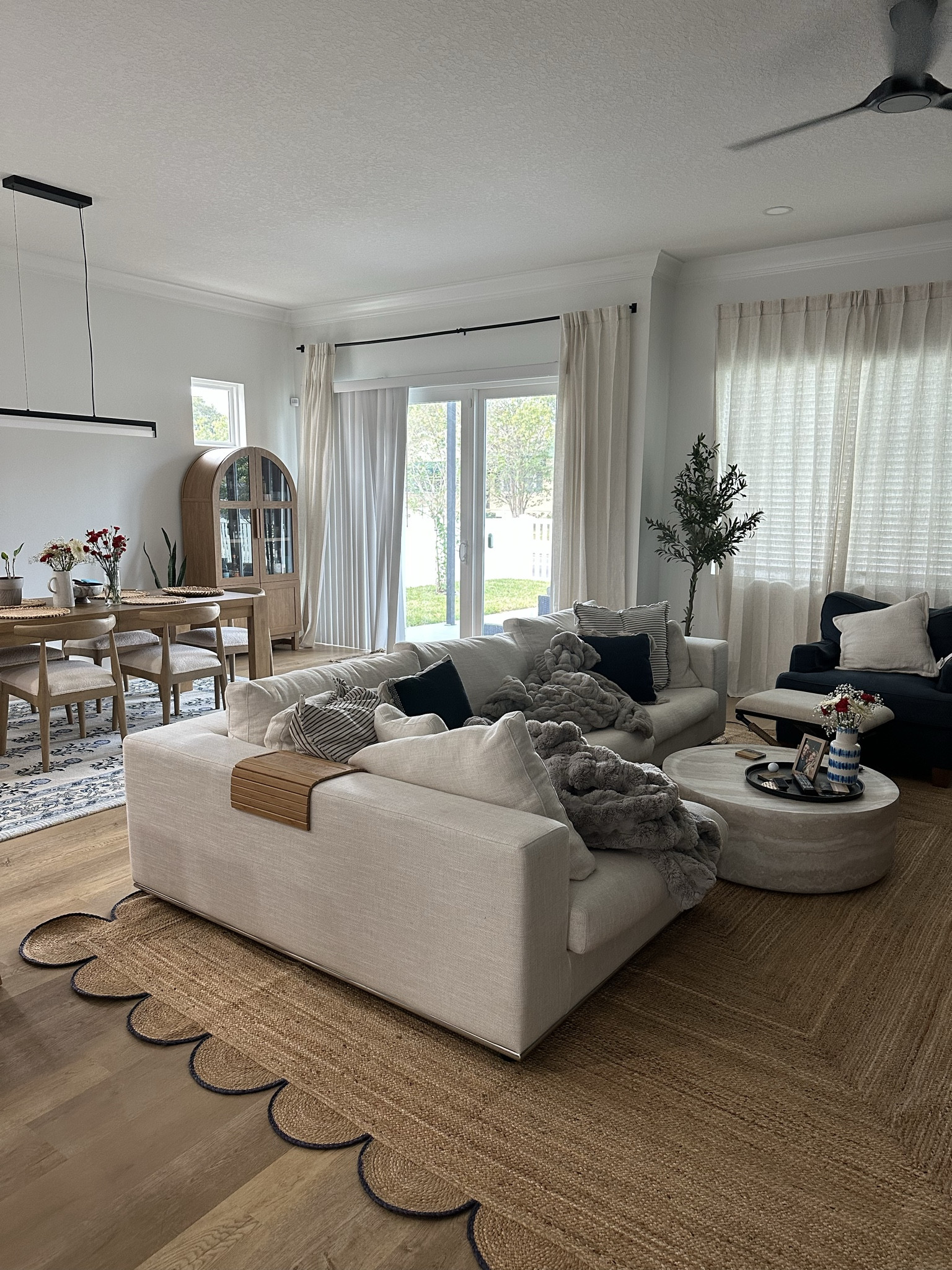 Amazon Scalloped Natural Jute Area Rug, Navy Trim, 11'x14. Living room rug. Jute rugs.

#LTKFindsUnder100 #LTKHome #LTKSaleAlert