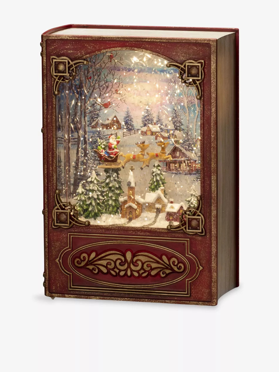 Red Book Santa Christmas Snow Globe 20cm | Selfridges