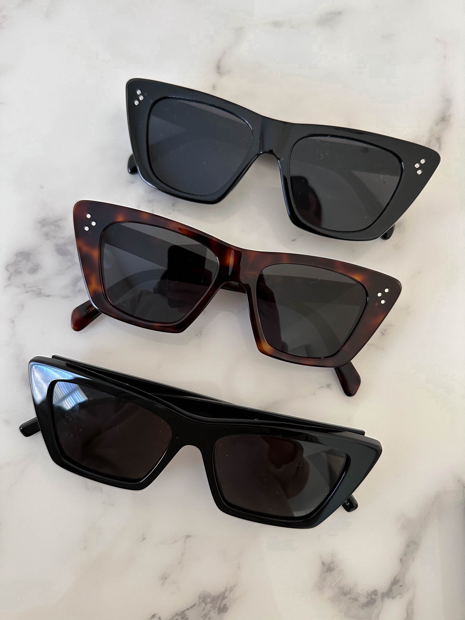 Cat eye sunglasses. 

Top - Amazon dupe. 
Middle - Celine
Bottom - YSL 