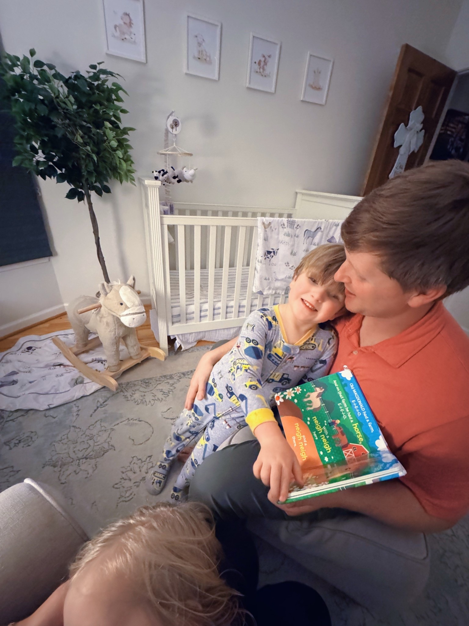 Oh how the Lord has blessed me immeasurably more with this precious view 🥹 - nursing 🤱 my littlest while my toddler is sitting in “Dada’s” lap for storytime 📖-  these truly are the days!! 🫶🏽👶🏼