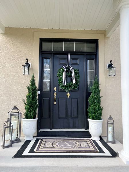 Shop my winter front porch here! This is a perfect way to transition from the holidays to give your front porch a fresh look for the in between seasons!

Faux Topiary
Cedar topiary 
Front door wreath
Faux greenery 
Black modern lanterns 
Front porch door mat 
New year decor 
Front porch refresh 

#LTKhome #LTKSeasonal #LTKFind