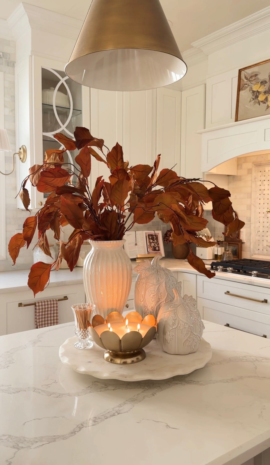 Fall centerpiece with @Magnolia branches and @Walmart  pumpkins