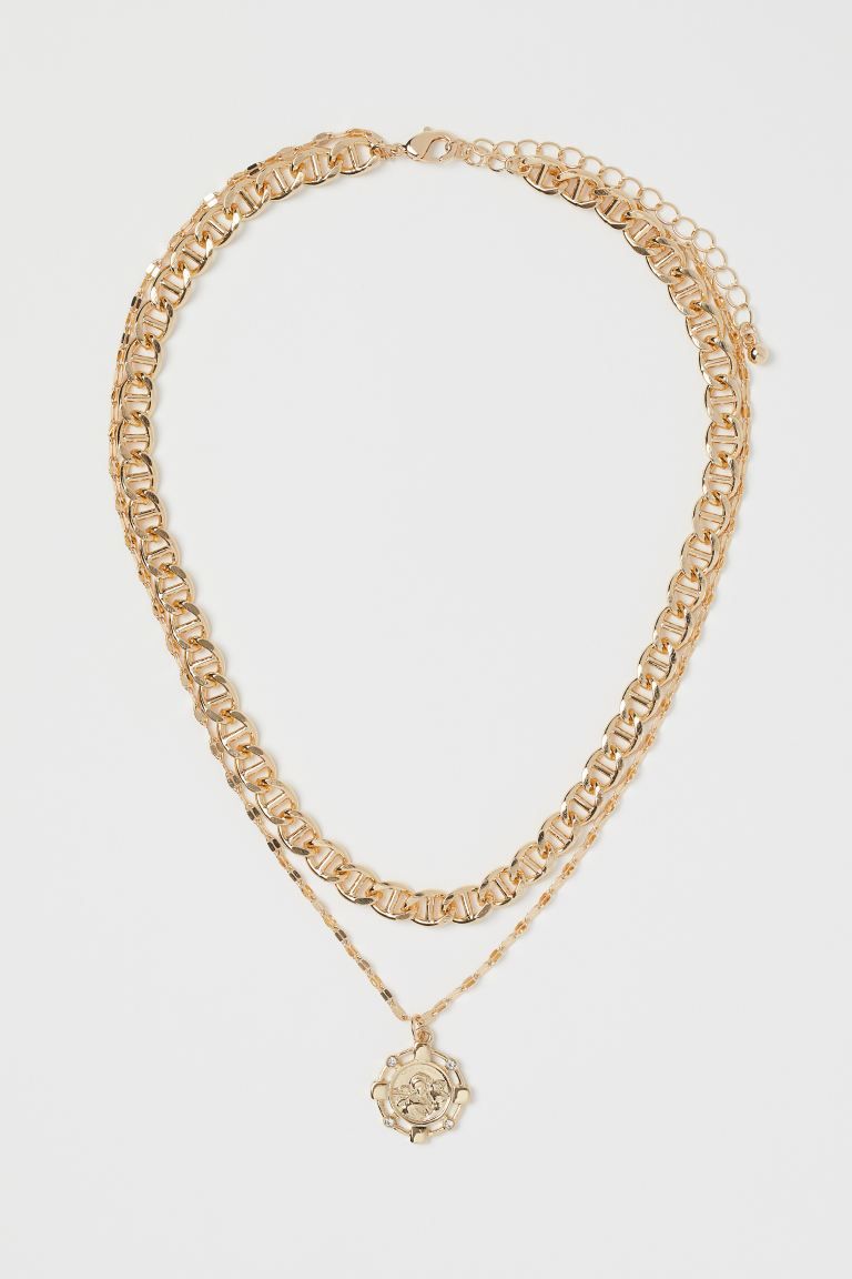 Double-strand necklace of metal chains of different lengths and thicknesses. One chain with embos... | H&M (US)