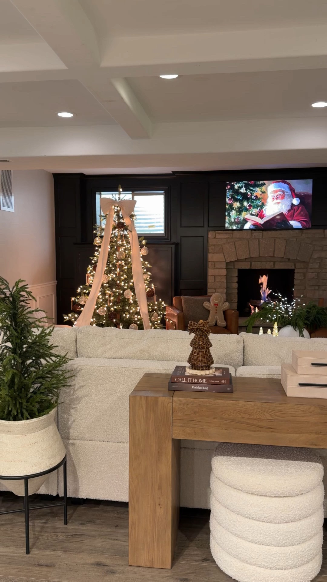 Christmas is slowly making its way into our home! 🎄✨ One of my favorite cozy views, especially with the tree glowing, fireplace on, and Christmas movies playing. 🤎

Shop my Christmas home favorites here! ✨