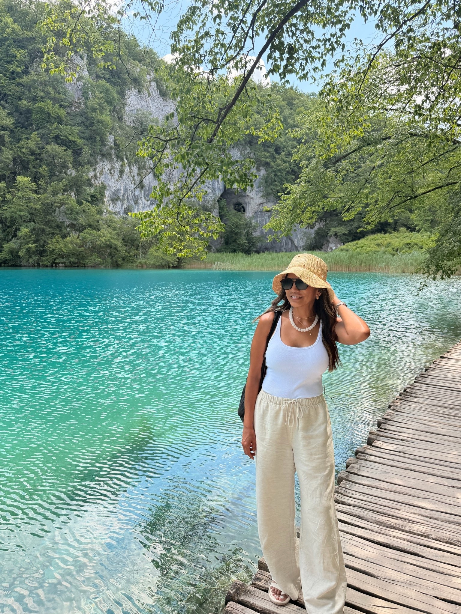 I’m 5’2” 118#ish for reference 
Europe outfit- I wore while  hiking Plitvice National Park 
Tank top with built in bra in small tts.
Linen pants that don’t wrinkle easily in small short length. Come in length options. Color is Undyed Ecru.
Sandals tts.
Accesories are linked.

#LTKPetite #LTKTravel #LTKActive