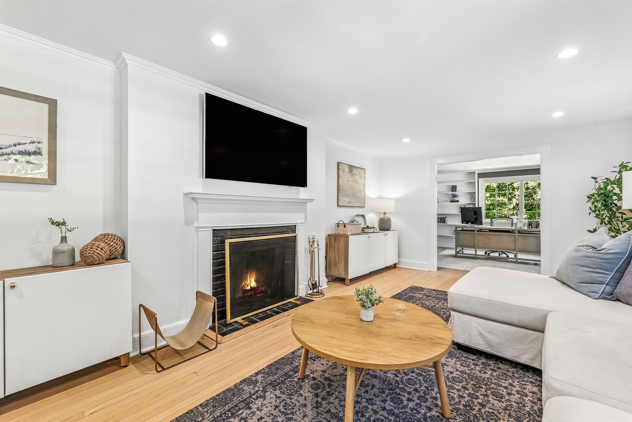 Designed for everyday comfort and cozy nights in. This family room centers around a plush sectional and a glowing fireplace — the perfect spot to gather, unwind, and stay a while.

📷 by Houlihan Lawrence
