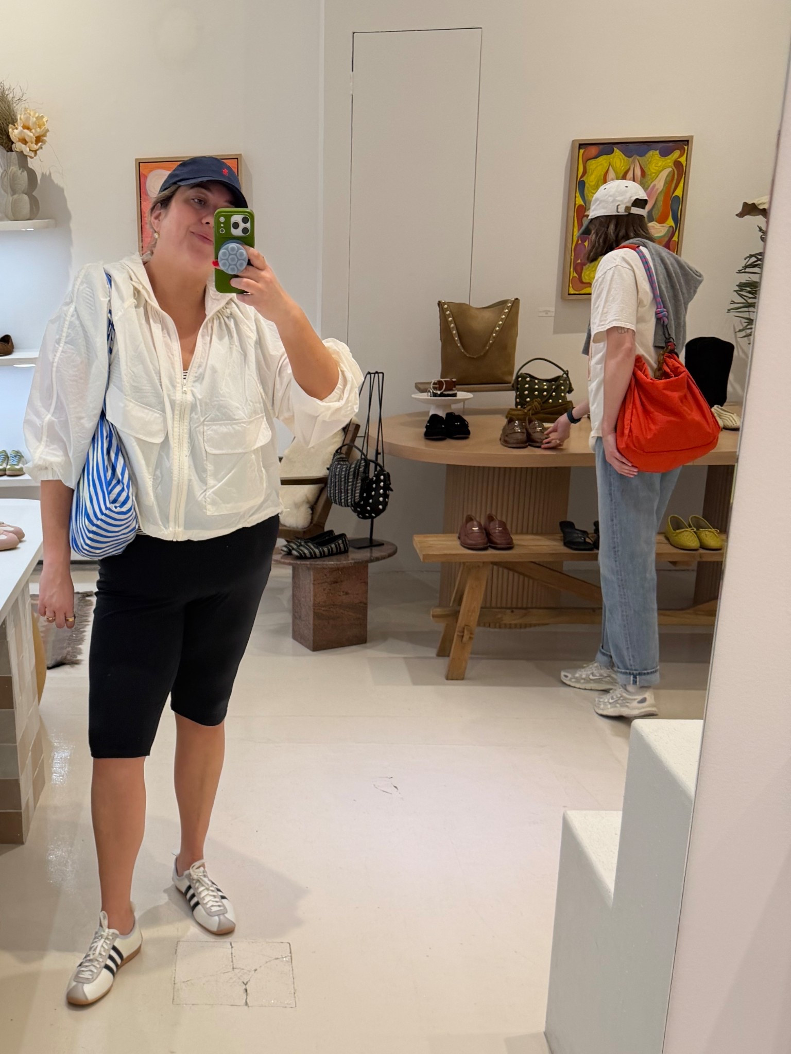 I always think I'm too old for trends, but I was repoing windbreakers before they were. So I'm all in on this one it's very easy - especially this Old Navy one! I would size up at least one (I did one size here and wish I had sized up two) for an extra loose fit (the style). My legging capris are no longer available but linked similar. 


Always love a Baggu bag on trips to cities where I'll shop because I don't have to carry as many bags, plus it looks cute! 

And I love these Adidas sneakers. Walked 15k plus steps in them without foot pain. True to size chart. 

My exact hat is linked, but I think it's worth buying any of the Polo hats fo accessorizing! I use mine so much! 

