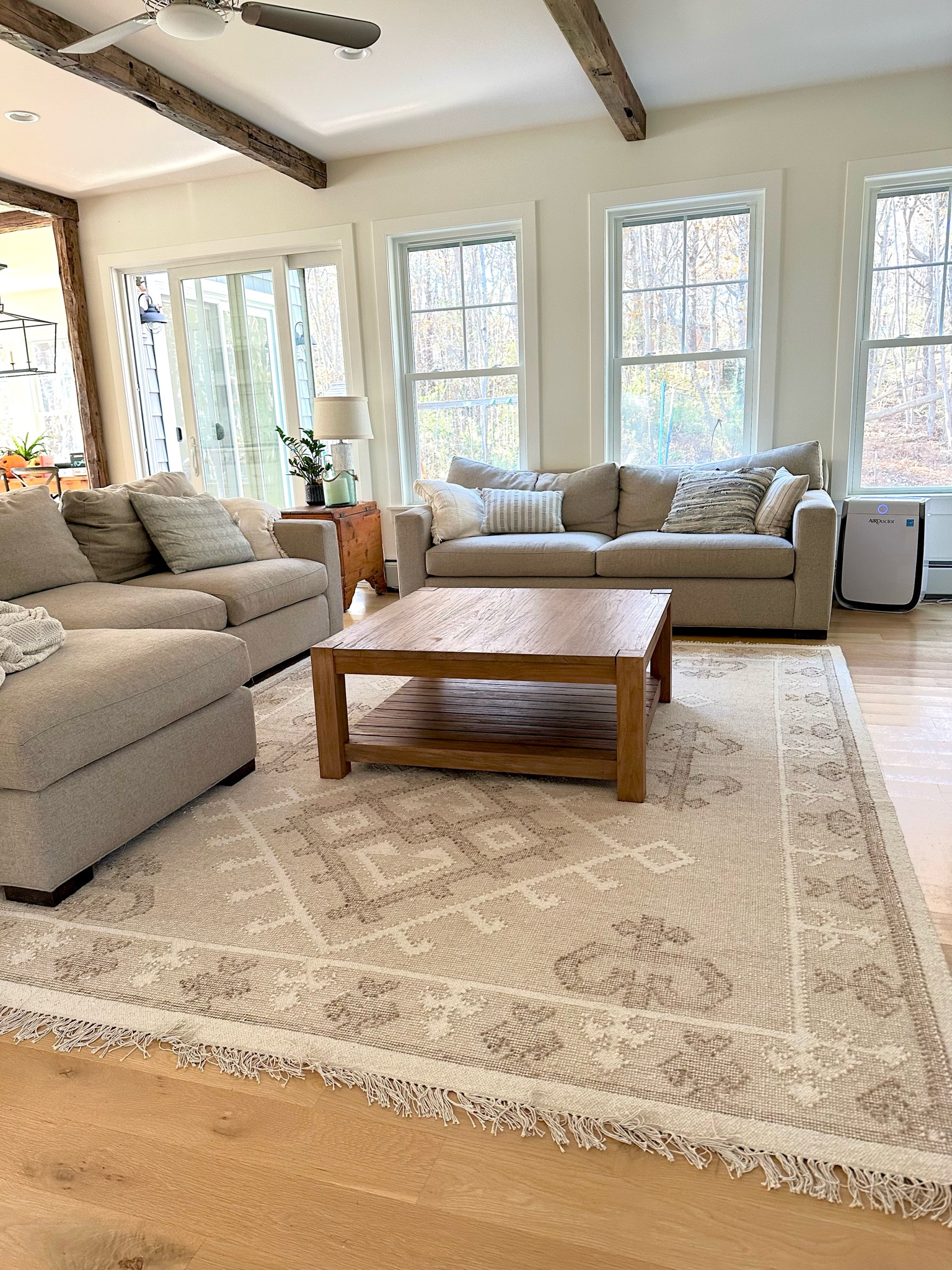 Cozy coastal family living room. Rug, sectional couch, coffee table, rattan baskets, lamp

#LTKover40 #LTKfindsunder100 #LTKhome