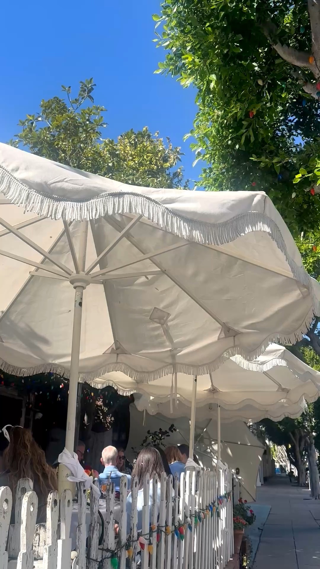 kind of detail that instantly sets the scene. Linked here. #PatioUmbrella #FringeUmbrella #OutdoorStyle #PoolsideLiving #ChicOutdoor #SummerReady

#LTKFestival #LTKHome #LTKdayinmylife