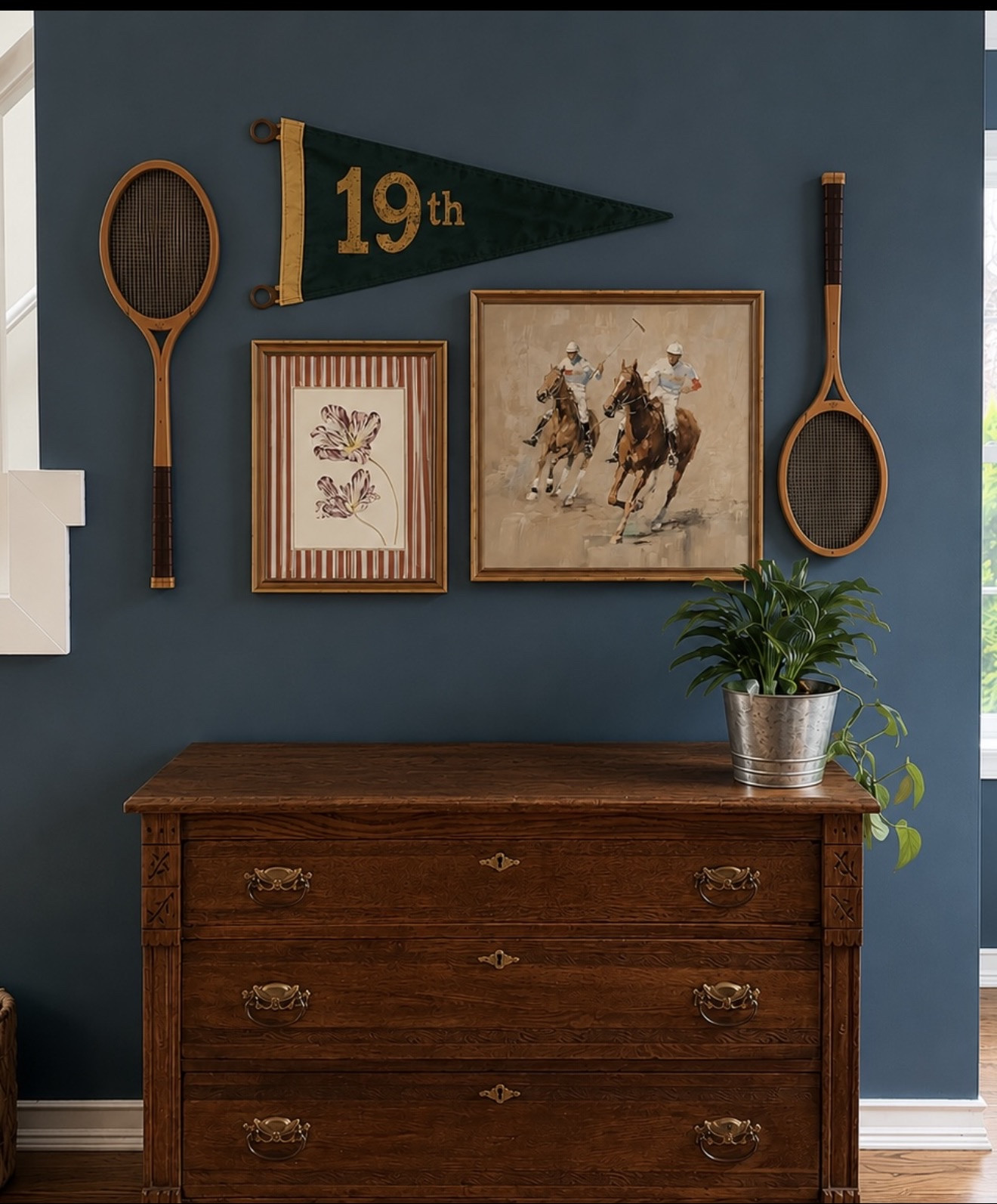 Gallery wall layout for our sports inspired lounge room. I love the dark and moody feel to the space. #artwork #gallerywall #gameroom

#LTKHome #LTKMens
