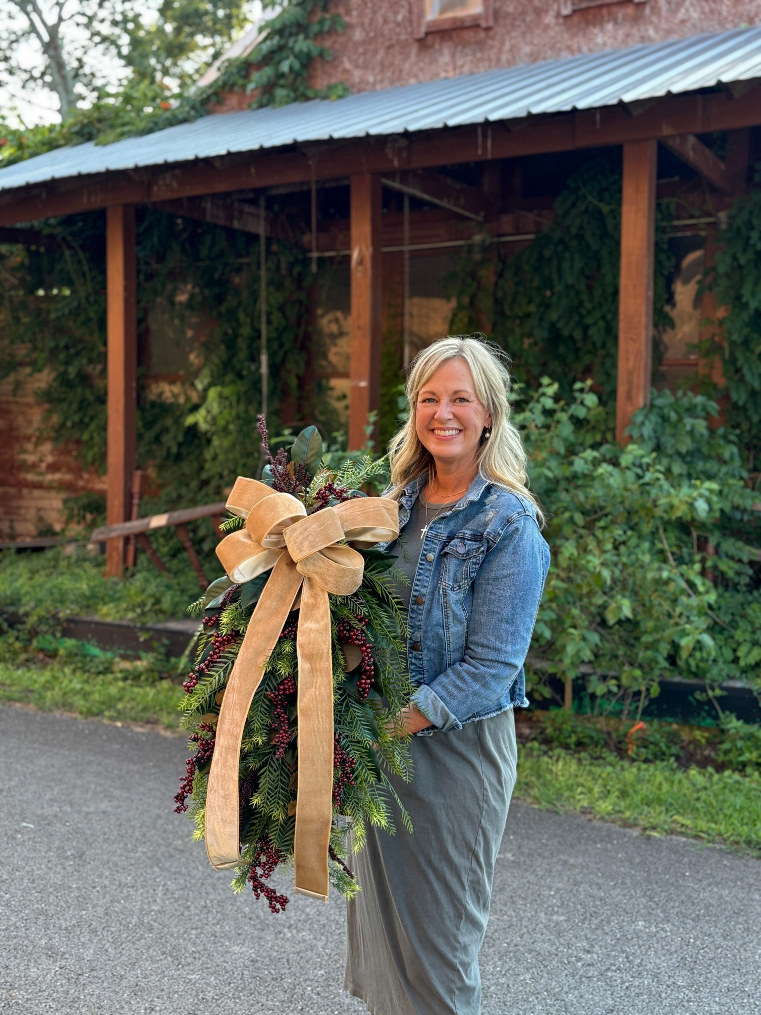 This magnolia winter door swag is stunning and designed with a lush mix of magnolia leaves, cedar, fern, and rich red berries, all tied together with a luxurious gold velvet ribbon. Measuring approximately 36” tall x 20” wide x 7” deep, it’s the perfect statement piece for your front door, porch, or mantel.

Crafted with premium faux greenery, the Mabel Swag offers long-lasting beauty you can enjoy year after year. Its timeless blend of greenery and warm tones makes it ideal for farmhouse, rustic, and classic Christmas styles.


#LTKHome #LTKSeasonal #LTKU