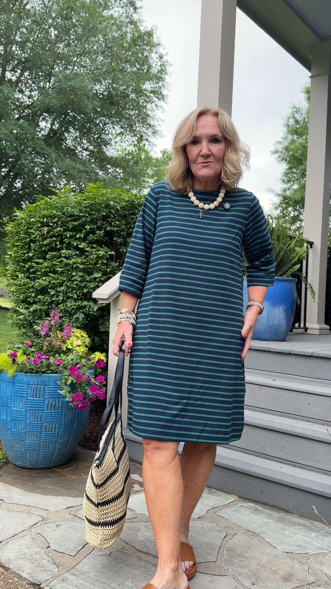Easy summer dresses are always a yes 🫶🏻

This striped dress is relaxed, comfortable, and one of those throw-on-and-go pieces that still looks polished. I love the easy fit, soft fabric, and classic stripe combo for everyday summer style.

Styled it with simple slides and a woven tote for an effortless casual look.  

 #LTKootd #LTKSeasonal #LTKOver40
