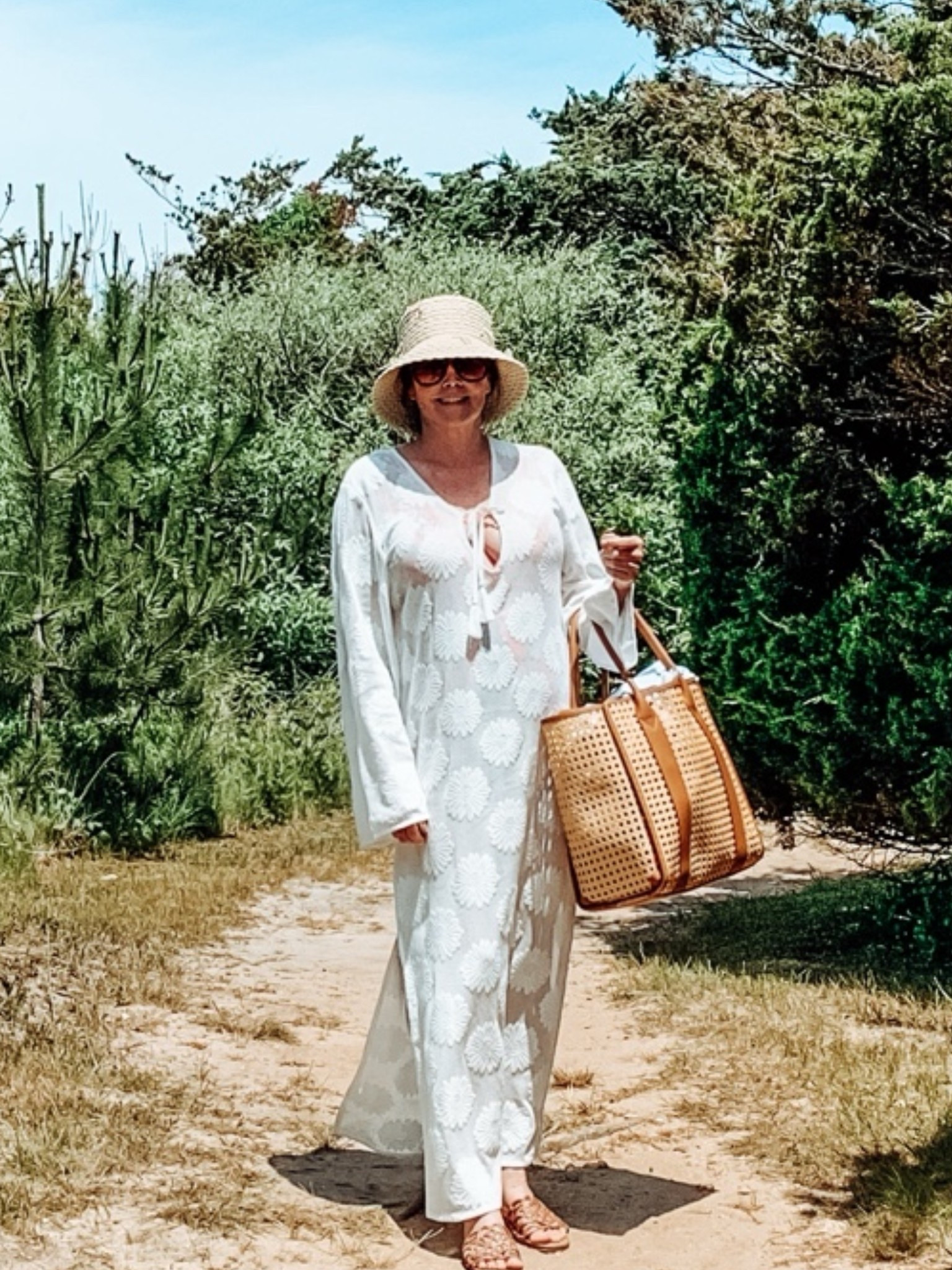 Beach Day: This Caning Tote is waterproof. Swimsuit is Boden, Coverup is Loft & Sandals are from Target.

#LTKTravel #LTKSwim #LTKOver40