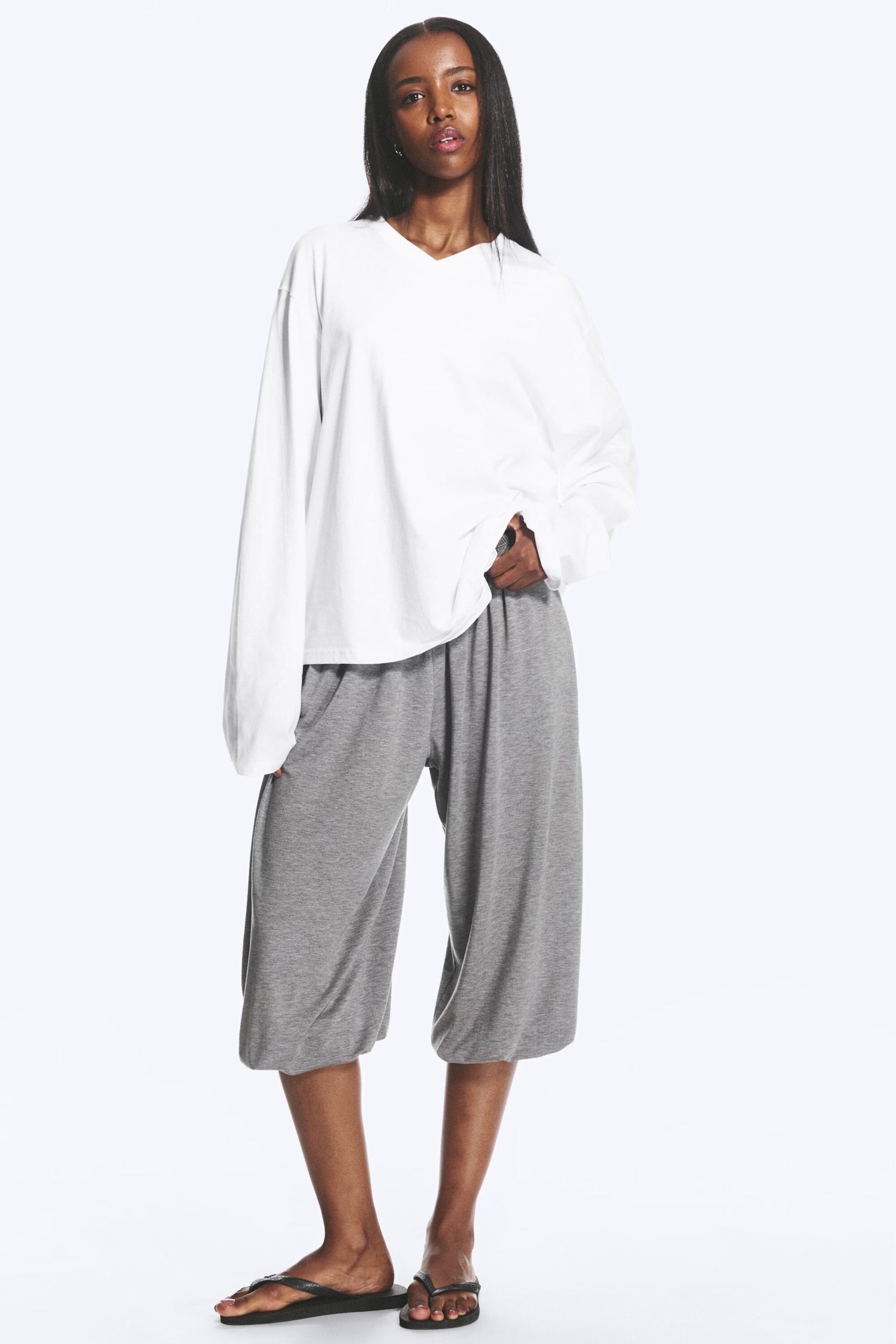 My styling trick: Swap your long-sleeved crew neck for a V-neck. It changes the proportions completely.