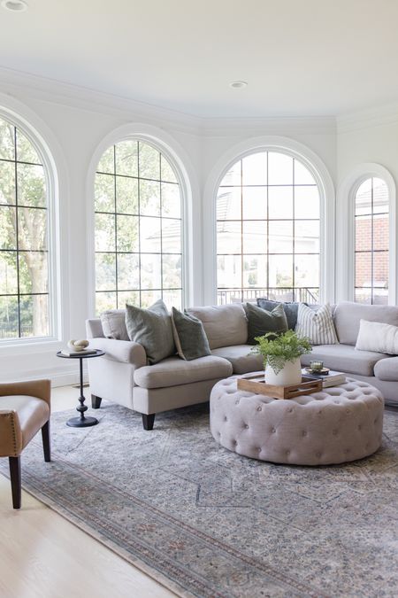 Family room, moody rug, upholstered ottoman, round ottoman

#LTKhome #LTKsalealert #LTKstyletip