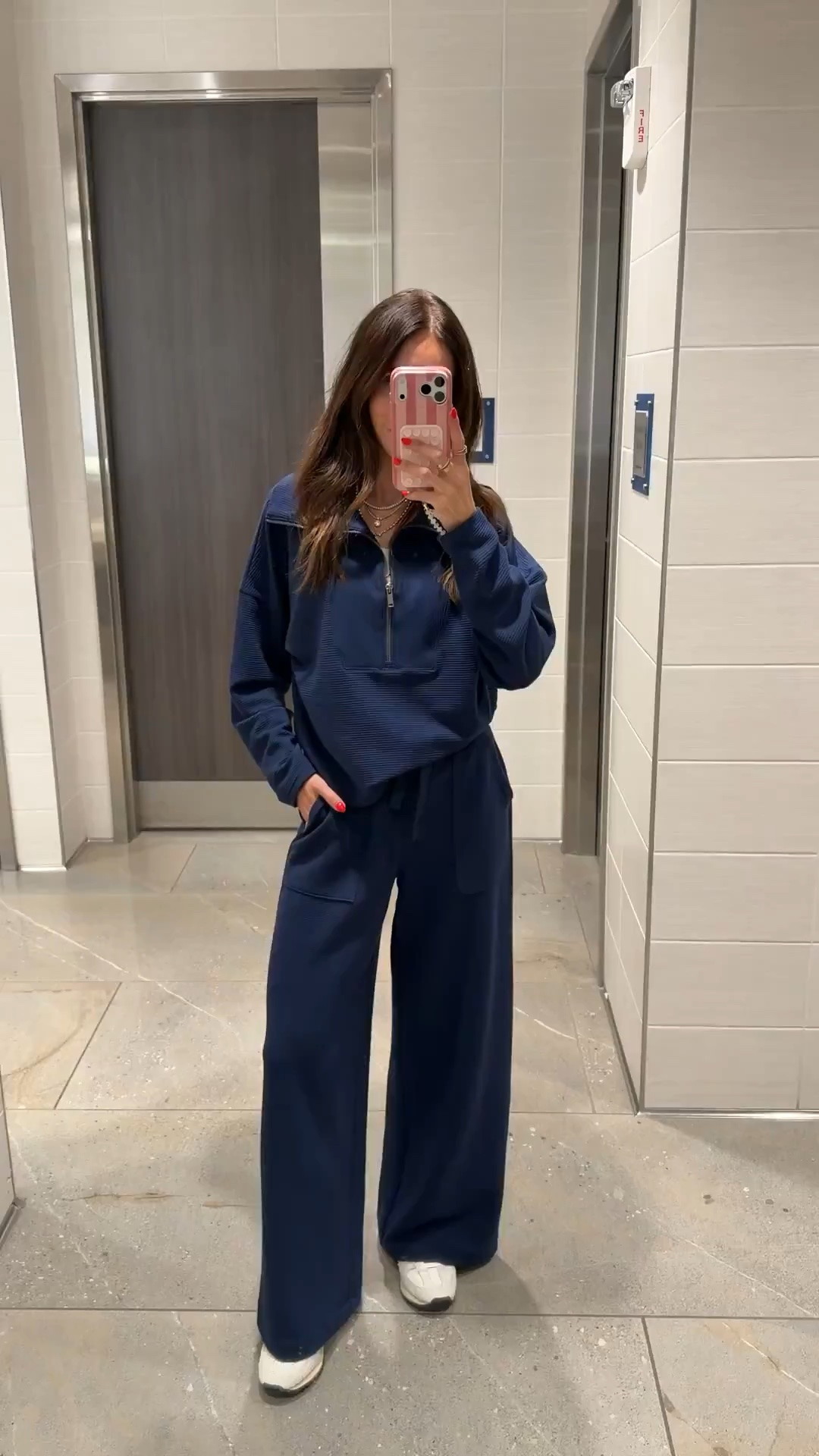 I wore this navy matching set for a travel day because the drawstring waist and wide leg pants stay comfortable while still looking polished. The textured quarter zip adds structure to the monochrome look, and white sneakers keep it practical for walking through the airport.

navy matching set, travel outfit, quarter zip pullover, wide leg pants, airport style, comfortable travel outfit, monochrome outfit, casual athleisure, white sneakers, fall transition outfit, annabrstyle

#LTKootd #LTKTravel #LTKdayinmylife