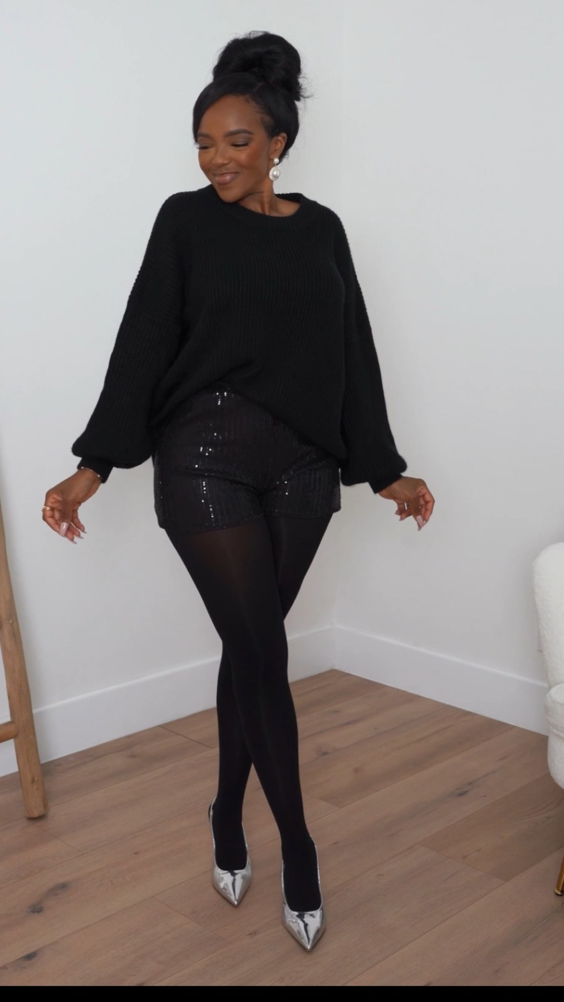✨ Cozy-Glam Holiday Look  
An easy all-black outfit that feels festive without trying too hard. The mix of a slouchy knit with sequin shorts and sheer tights is the perfect balance of chic, comfortable, and party-ready. Effortless, elevated, and so good for any holiday moment.

Shop instantly on the app.

Kira’s measurements: 5'4”, 138 lbs, 34D, 27" waist, 40" hips

All-black holiday outfit ideas, sequin shorts styling, cozy glam winter look, festive party outfit, chic monochrome fashion, elevated holiday wardrobe essentials.

Follow me on Instagram and YouTube @kirasfashionfinds

#LTKHoliday #LTKgrwm