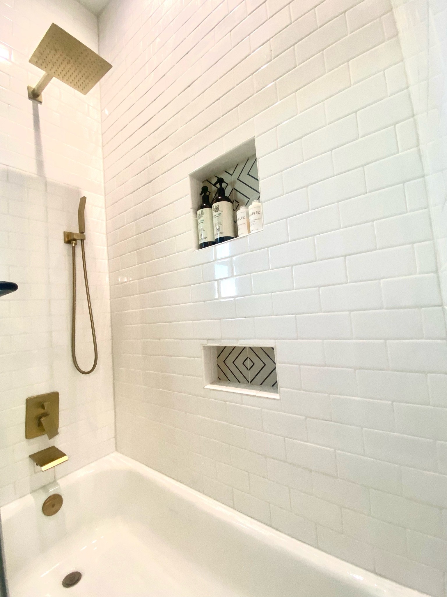 Bathroom 

#bathroom #shower #tub #showerhardware #showerfixture #tubstopper #tubdrain #tubplug #goldtubstopper #whitesubwaytile #subwaytile #shampoo #conditioner #showerhead #showerfaucet #tubfaucet #whiteshower #guestshower #teenshower #modernshower #moderndesign #modern #whitebathroom #bathroomstyle 

#LTKhome #LTKstyletip