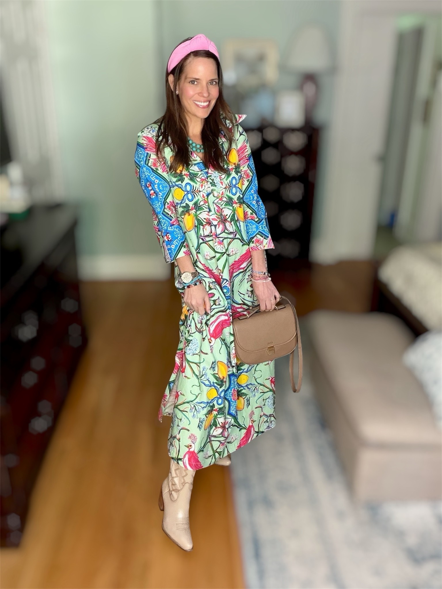 Mint Chinoiserie Maxi Dress & Neutral Cowboy Boots 💚🌸

This Mint Chinoiserie maxi dress is such a wearable statement piece 💚🌺 Inspired by hand-painted chinoiserie panels, the print features birds, citrus, blossoms, seashells, and ribbon details layered over the prettiest soft mint backdrop. I love the relaxed silhouette, flowy pleats, side pockets, and classic collar for an effortlessly elevated look ✨

Styled it with neutral cowboy boots, turquoise jewelry, stacked bracelets, and a pink headband for a fun colorful twist 🤠💖 You can wear it loose for an easy breezy feel or add the optional obi sash to define the waist.

Chinoiserie dress, colorful maxi dress, mint green dress, western boots outfit, statement dress outfit, resort wear style, feminine fashion, colorful preppy style, turquoise jewelry, boho western outfit, vacation dress, modest maxi dress, elegant everyday style 💚

#LTKootd #LTKSeasonal #LTKOver40