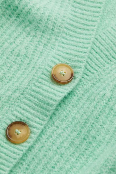 Cardigan in soft, rib-knit fabric with wool content. V-neck, buttons at front, dropped shoulders,... | H&M (US + CA)