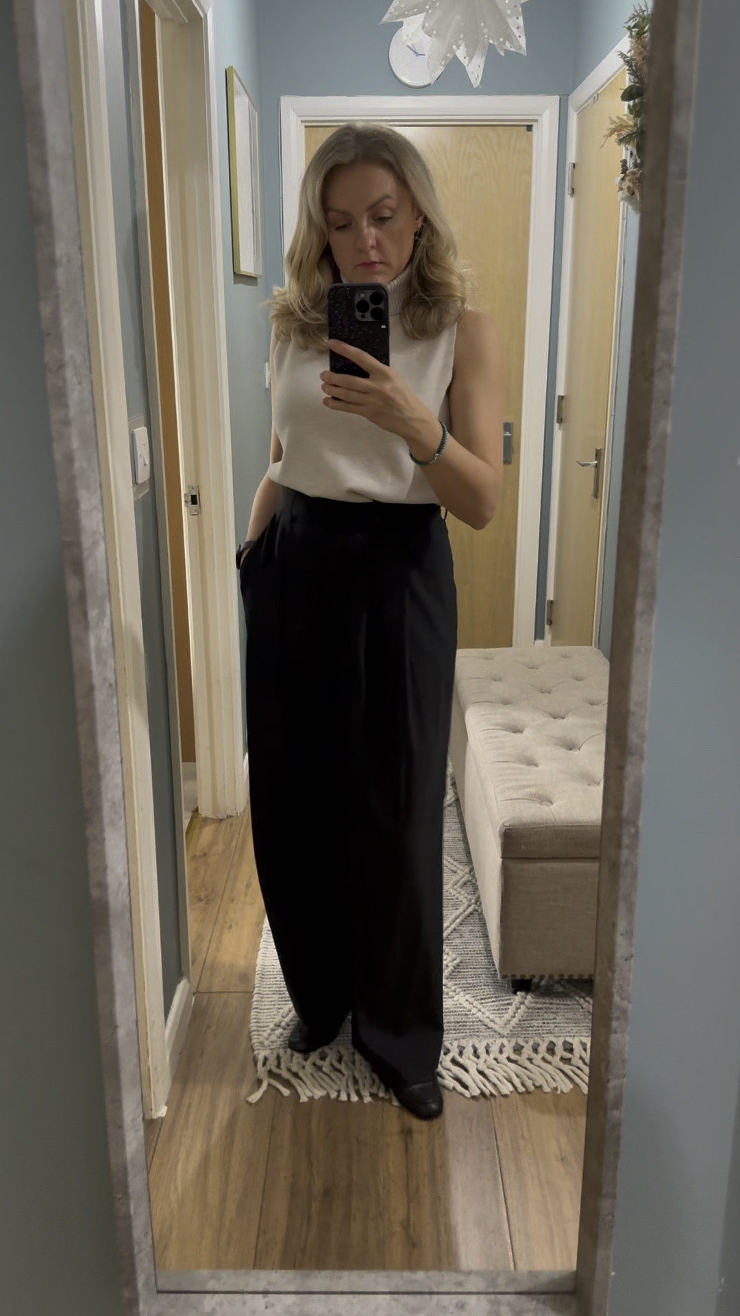 Cos Wide leg trousers and roll neck combo. Black wool trousers. Cream vest 

#LTKover40 #LTKstyletip #LTKworkwear