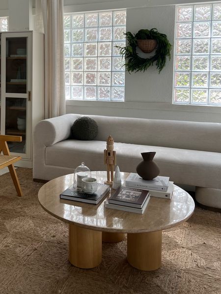 Living room: Coffee table, rug, sofa, sconce, white cabinet 

#LTKstyletip #LTKhome #LTKsalealert