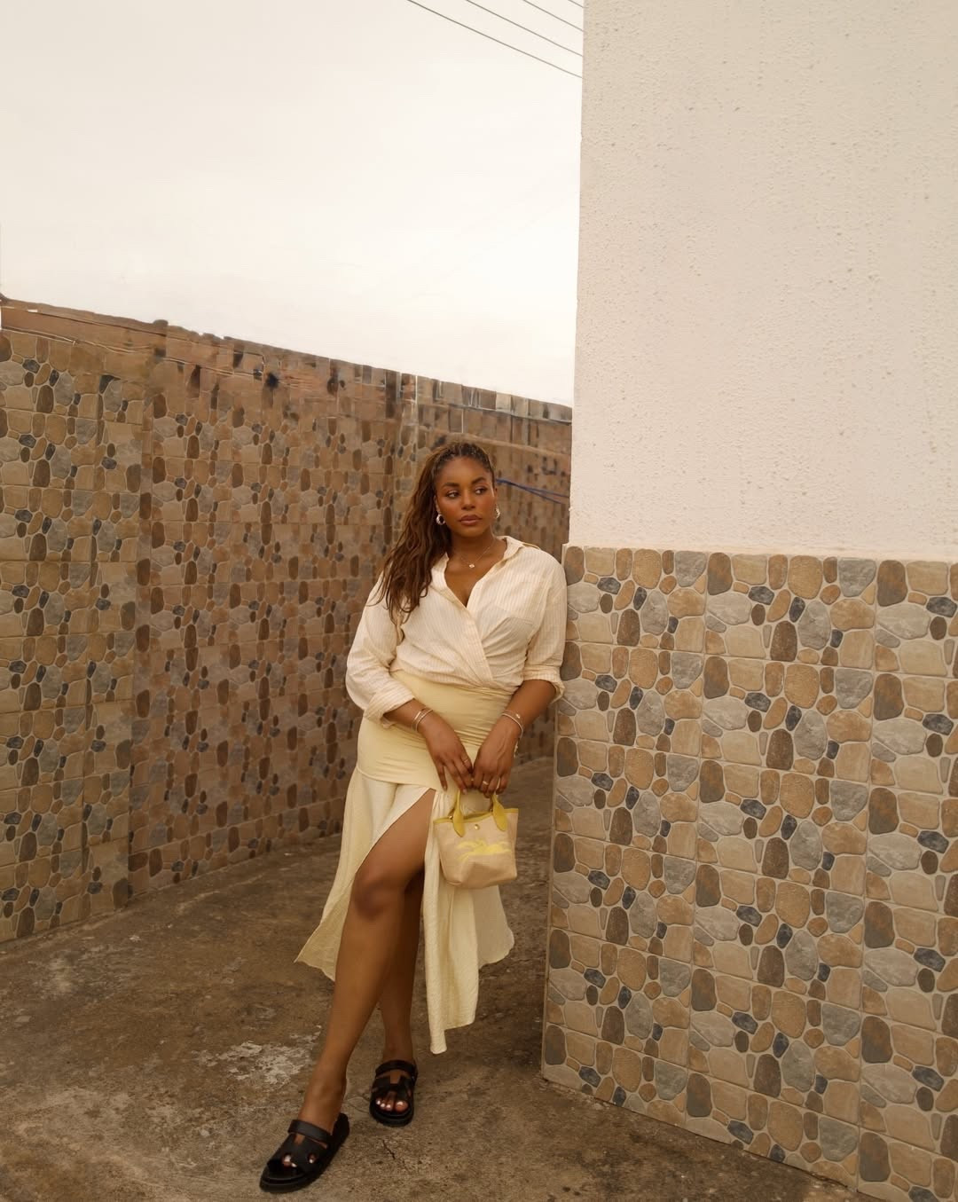 Butter yellow spring outfit. Wearing a pastel yellow stripe button up shirt, midi skirt, black sandals, longchamp handbag - linking similar styles below! … For more links to spring outfits 2026, easter dress women, easter outfits women, date night outfits, vacation outfits beach, spring dresses, easter basket ideas, work outfits, country concert outfits, follow me on LTK! ✨


#LTKootd #LTKFestival #LTKgrwm