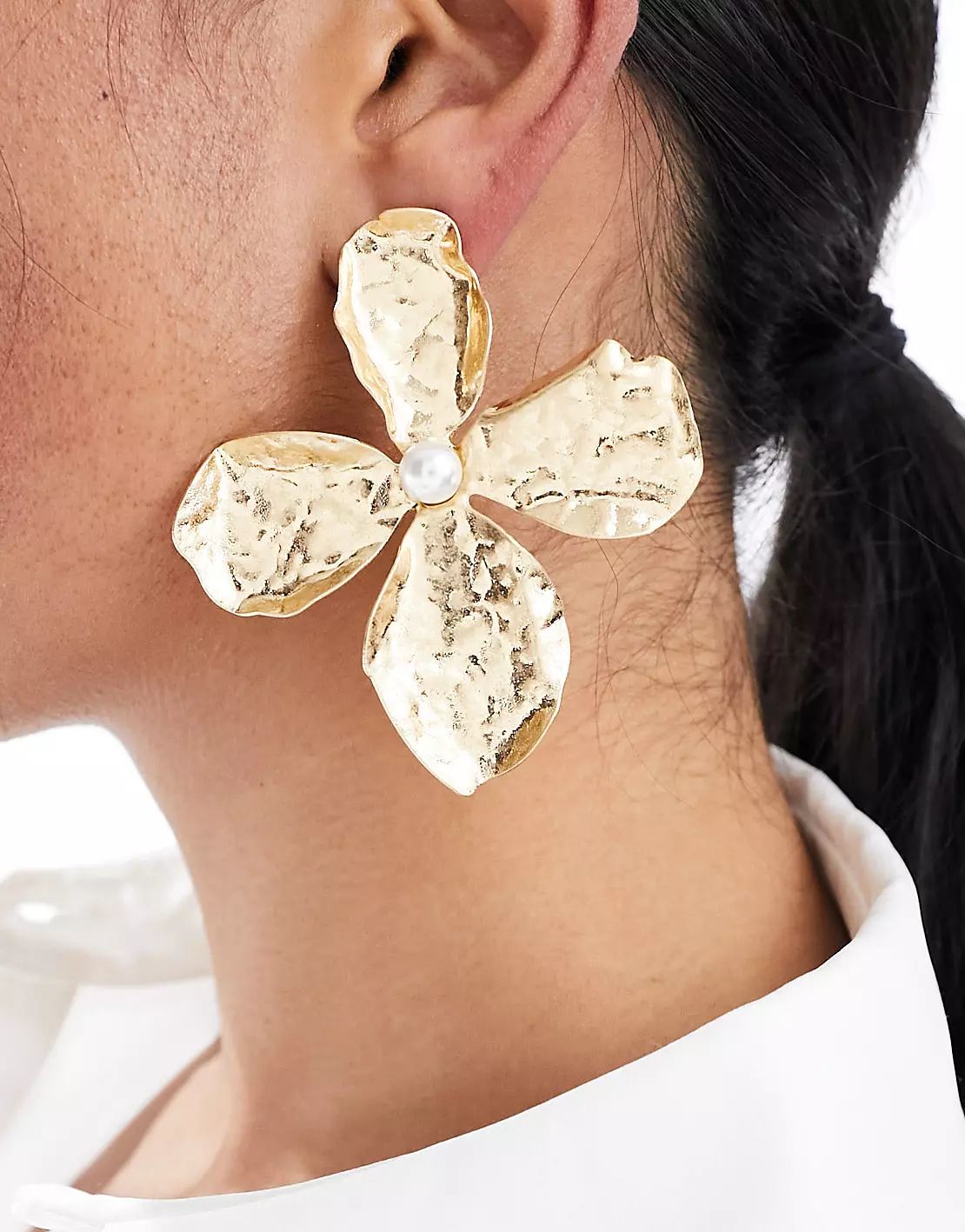 ASOS DESIGN oversized stud earrings with hammered floral design in gold tone | ASOS (Global)