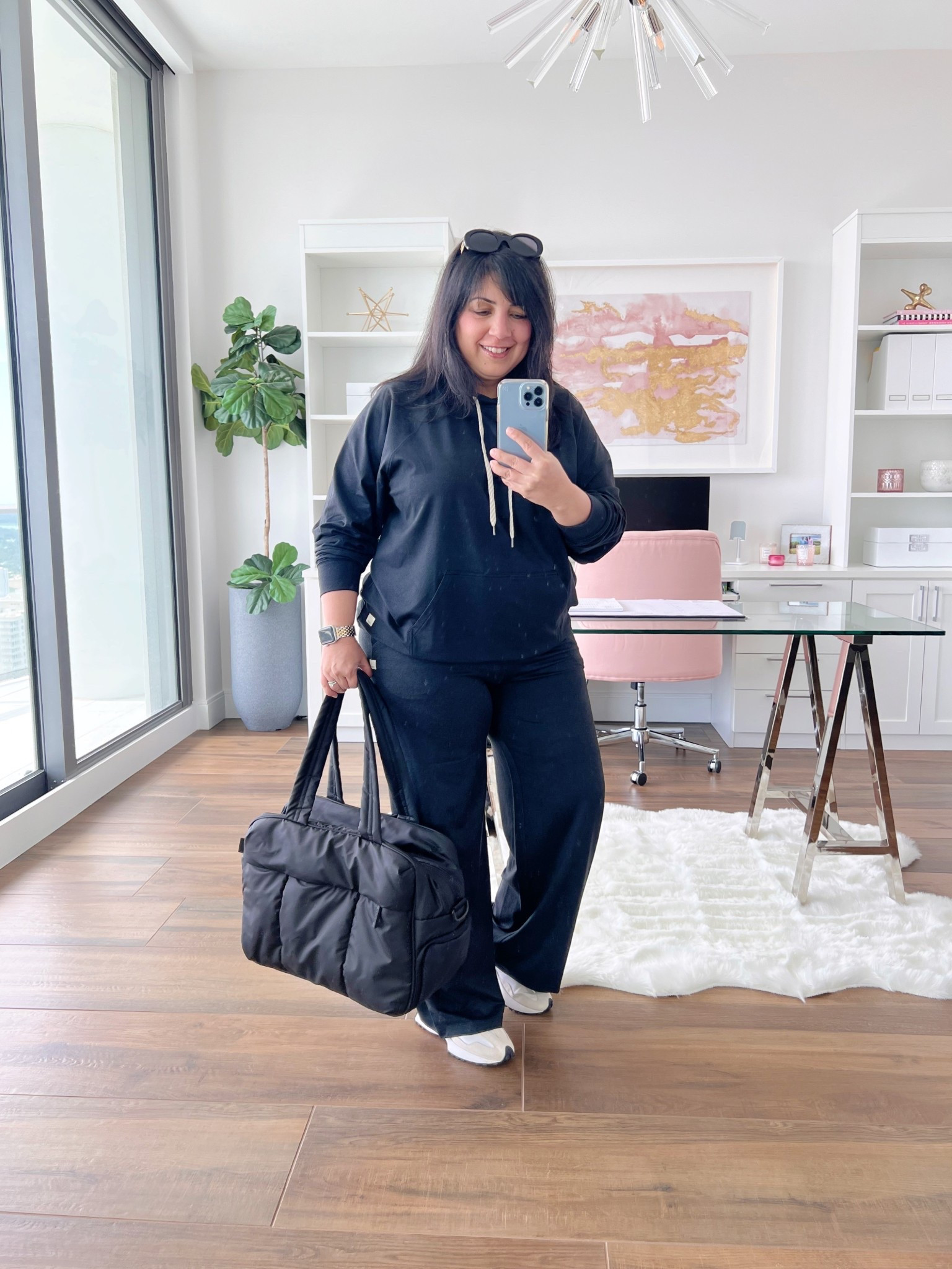 Travel outfit! Vuori Halo oversized hoodie and Halo Essential Wide Leg pants size large. The material is so unbelievably soft and comfortable and it’s very lightweight so it’s not too hot for the Warner months. New Balance 327 sneakers true to size. Celine sunglasses. CALPAK Luka duffel bag. 

#LTKActive #LTKTravel #LTKFallSale