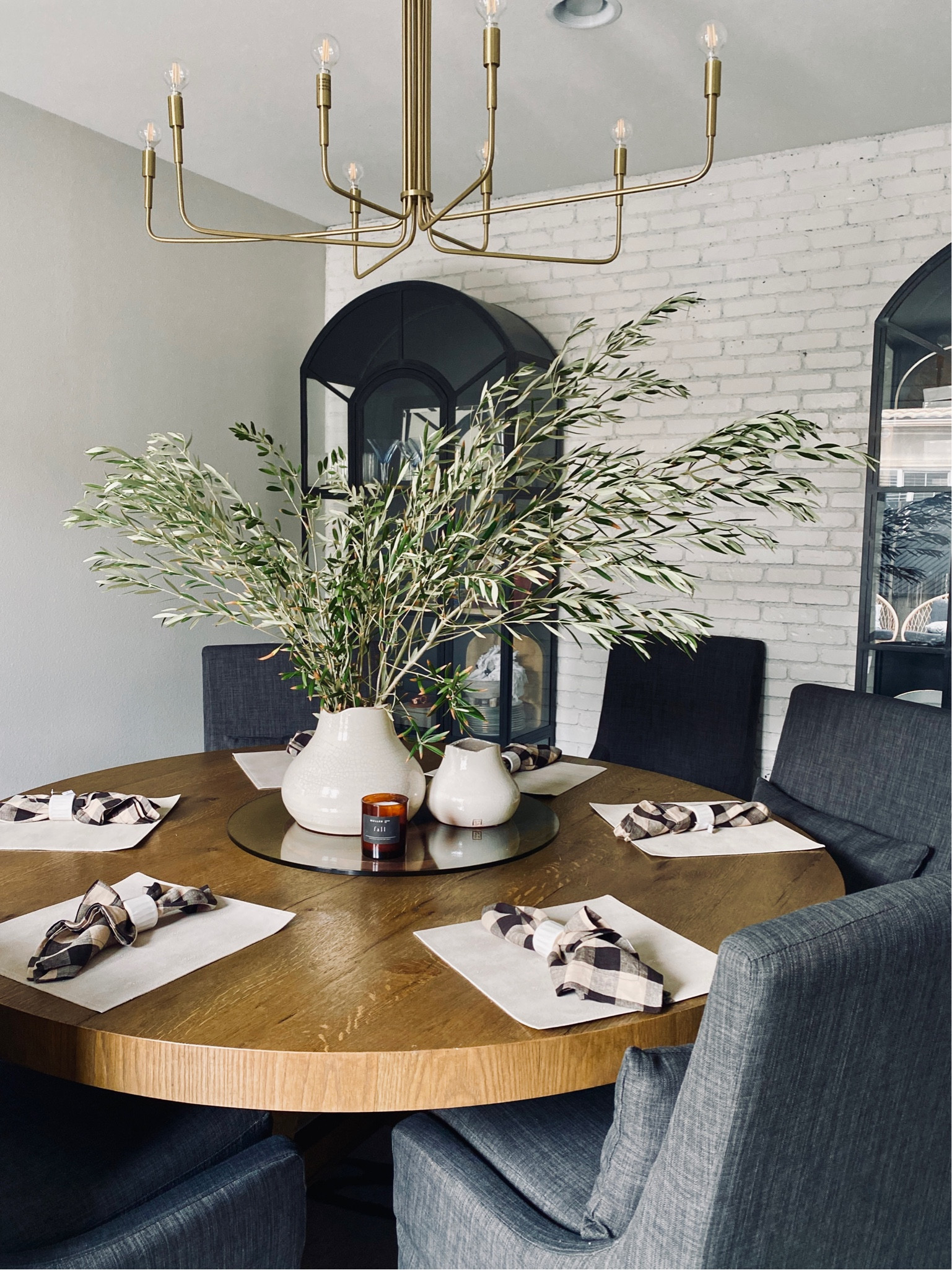 Let’s decorate for fall with @crateandbarrel 
Contrary to popular belief you don’t need a lot of pumpkins to decorate for fall! Simple changes to your every day decor is just as easy and simple. Swap out candlesticks, napkins, placemats, blankets and pillows for your fall refresh. I am in love with these gorgeous European Flax Linen napkins 😍  they come in many colors, and the quality is so amazing! Gingham is a favorite of mine so I paired them with this ceramic napkin ring, and some fresh olive tree stems. They also have a gorgeous matching rectangular table cloth as well! Add in some Amber glass or some candles, and you will have a simple fall refresh that is lovely and without all the pumpkins. 
#fallrefresh
#falldecor
#falltablestyling
#diningrooms
#tablescapes 

#LTKSeasonal #LTKstyletip #LTKhome