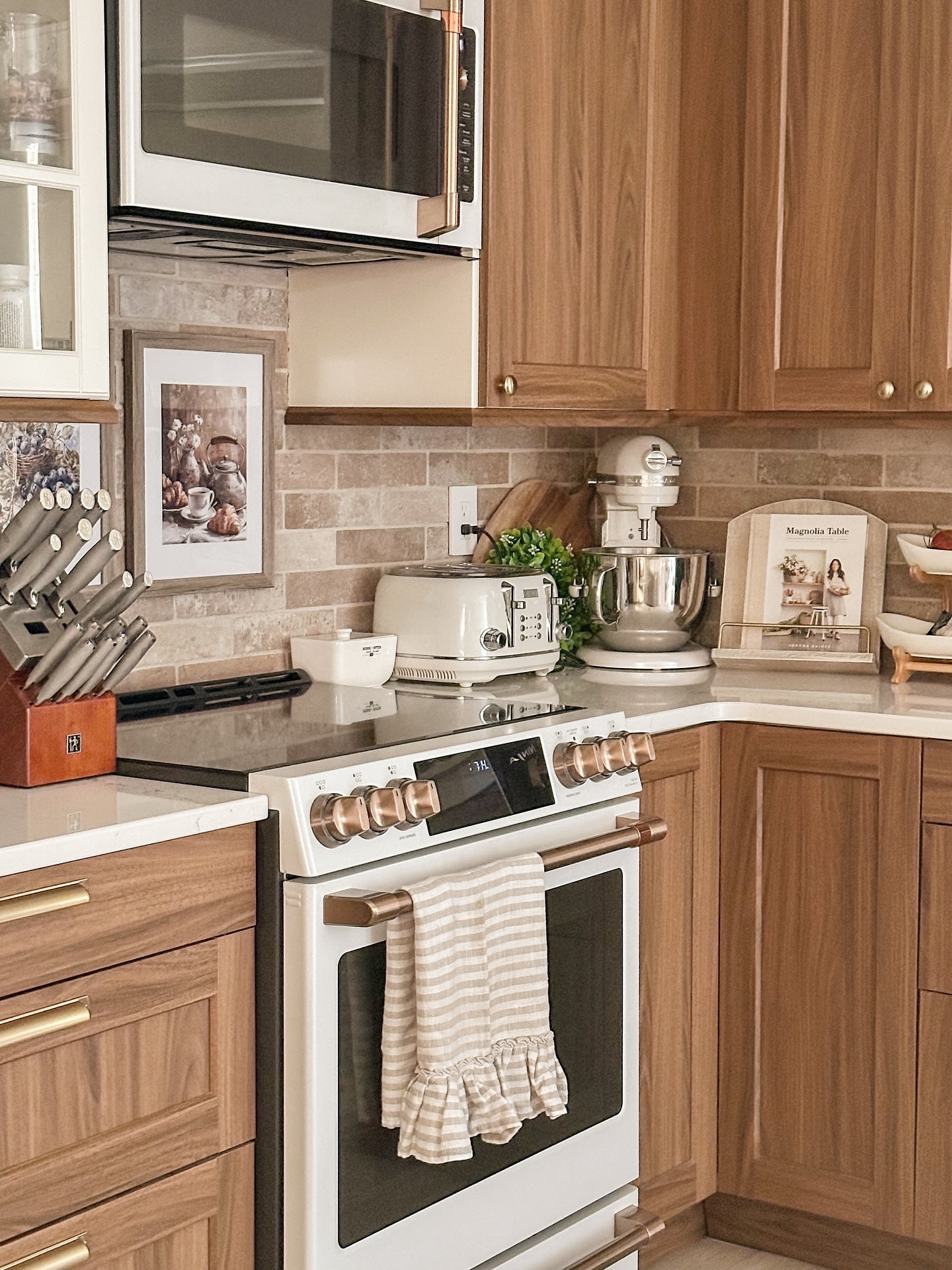 Just out here pretending my life is directed by Nancy Meyers.
The toast is golden, the coffee’s iced, the light is just right… and there’s probably a rogue sock under the table, but we don’t talk about that.
This kitchen isn’t perfect, but it’s finally starting to feel like home — cozy, a little cluttered, and full of the kind of charm that makes me forget I don’t live near the ocean anymore. 

What’s your must-have for a cozy summer kitchen? (And yes, wine counts.)

#nancymeyersaesthetic #cozyhome #northernbc #ruralliving #countryhome #countryinteriors #ikeakitchen #cafeappliances #canadiangirl #interiordesign #interiorinspo