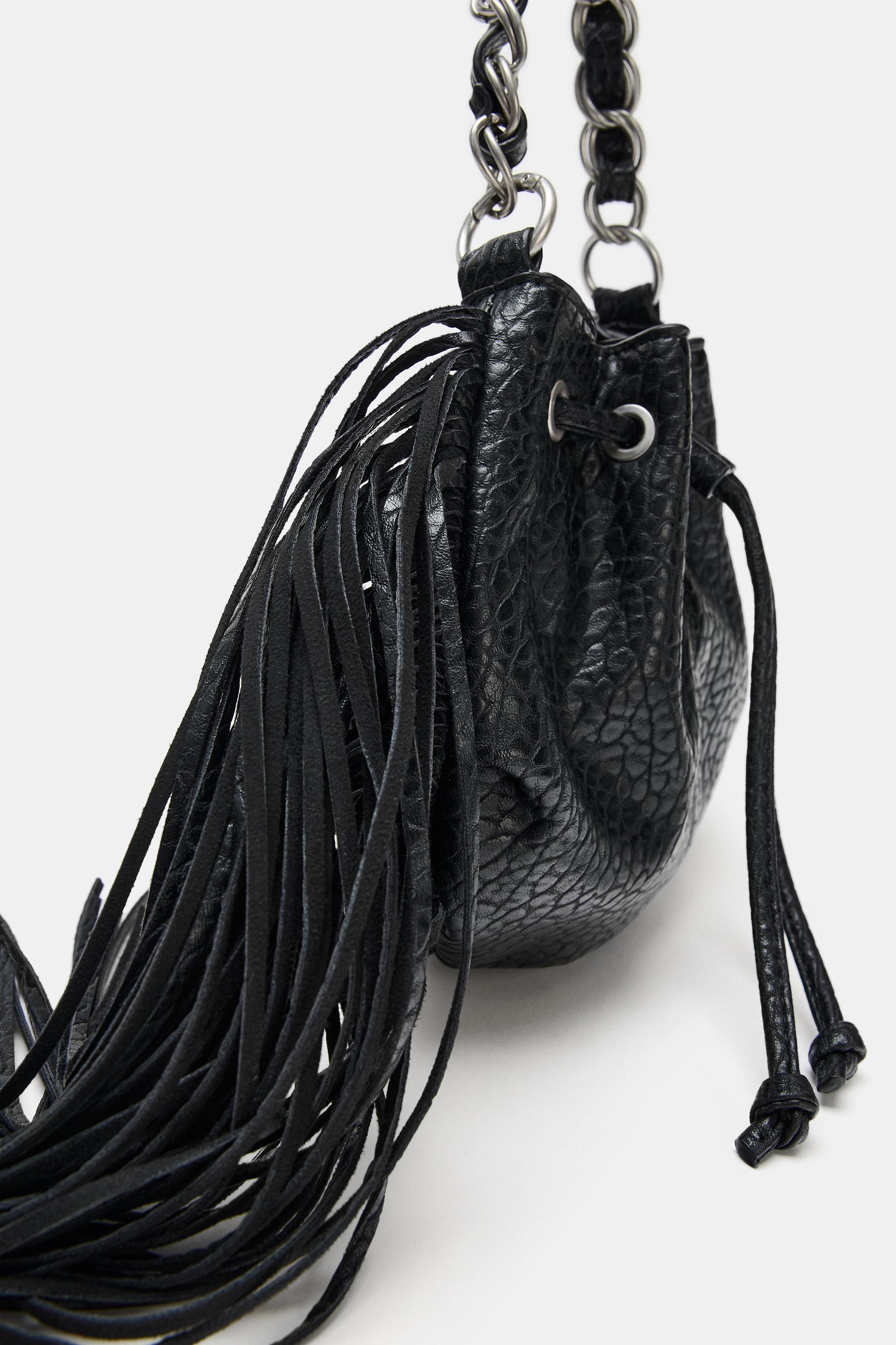 Textured shoulder bag featuring a metallic shoulder strap and a detachable crossbody strap. Detai... | Zara US