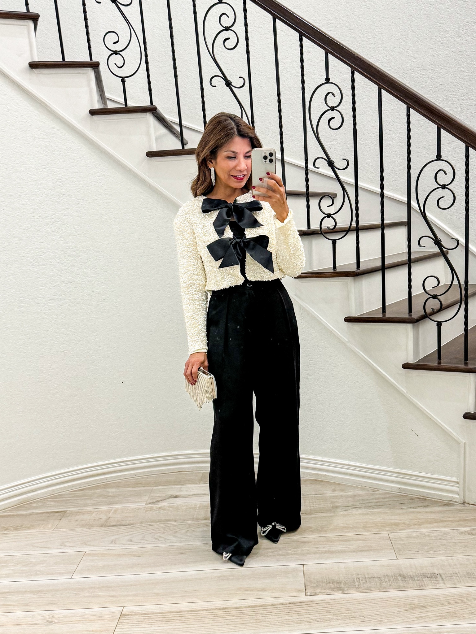 Holiday outfit. Sequined top in white (wearing a small, but I have the medium in black and I like both sizes). Satin pants in small tts. Shoes tts. Wearing bandeau underneath but tank top is fine. Red lips shade 861. Red lip liner Main Character. Accessories and bag are linked.

Holiday outfit, office party, Christmas party, work party, amazon finds, fashion over 50, midlife fashion, petite fashion, fashion over 40, sparkle

#LTKHoliday #LTKSeasonal #LTKStyleTip