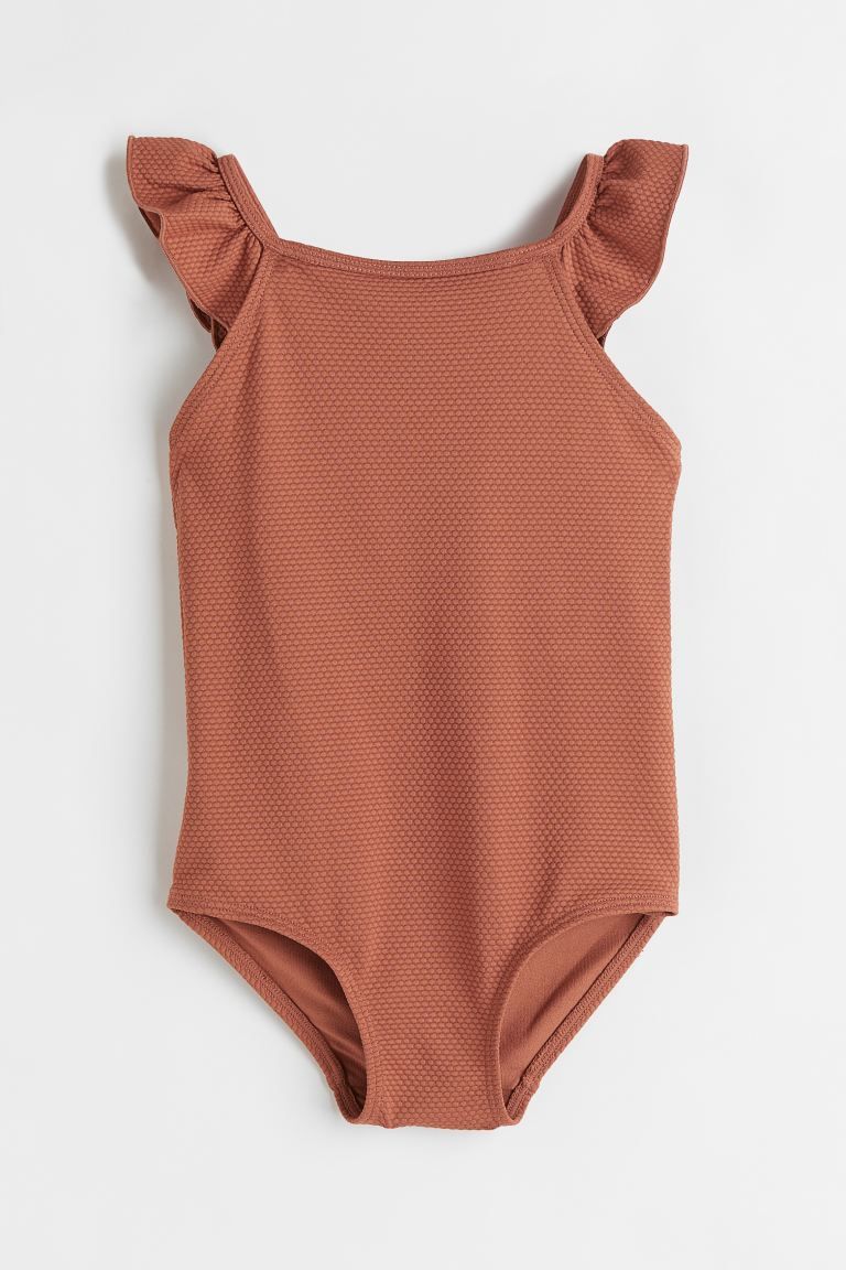 Kids Exclusive. Fully lined swimsuit in textured fabric with narrow, ruffle-trimmed shoulder stra... | H&M (US + CA)