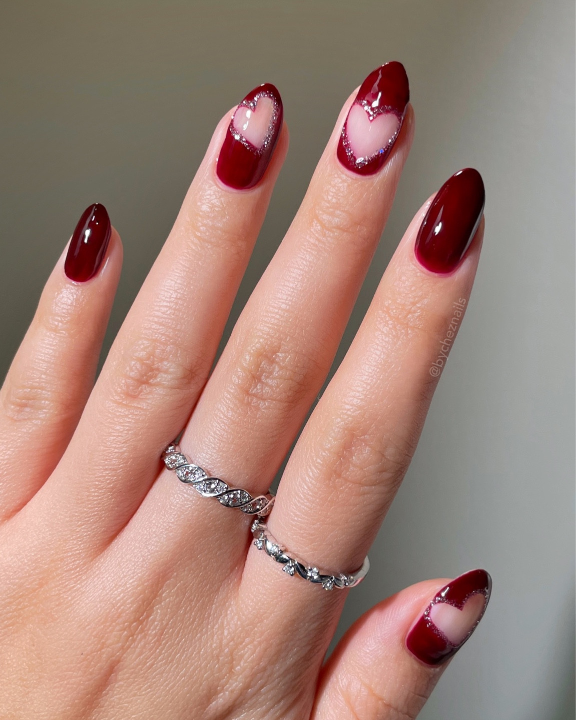 Cherry mocha heart nails for Valentine’s Day 🍒♥️ So cute and classy with a hint of holographic silver glitter. This is probably my favorite valentine mani of the year 🤭 red nail inspo, vday nails, glitter nails, red nail art, almond nails

#LTKbeauty #LTKwedding #LTKSeasonal