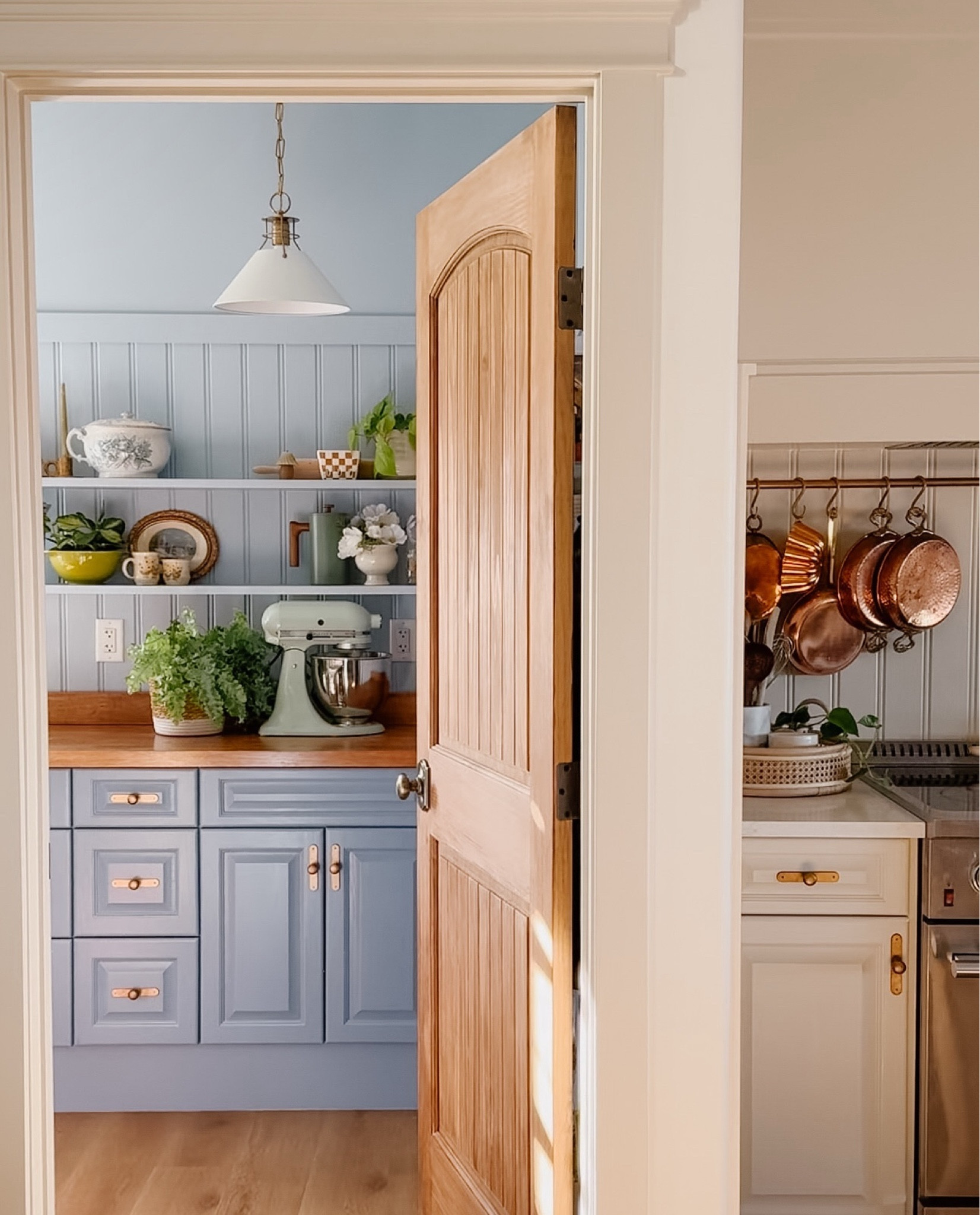 Blue English country cottage inspired pantry, wainscoting, wall panels, beadboard, arched wooden door


#LTKSaleAlert #LTKHome #LTKStyleTip
